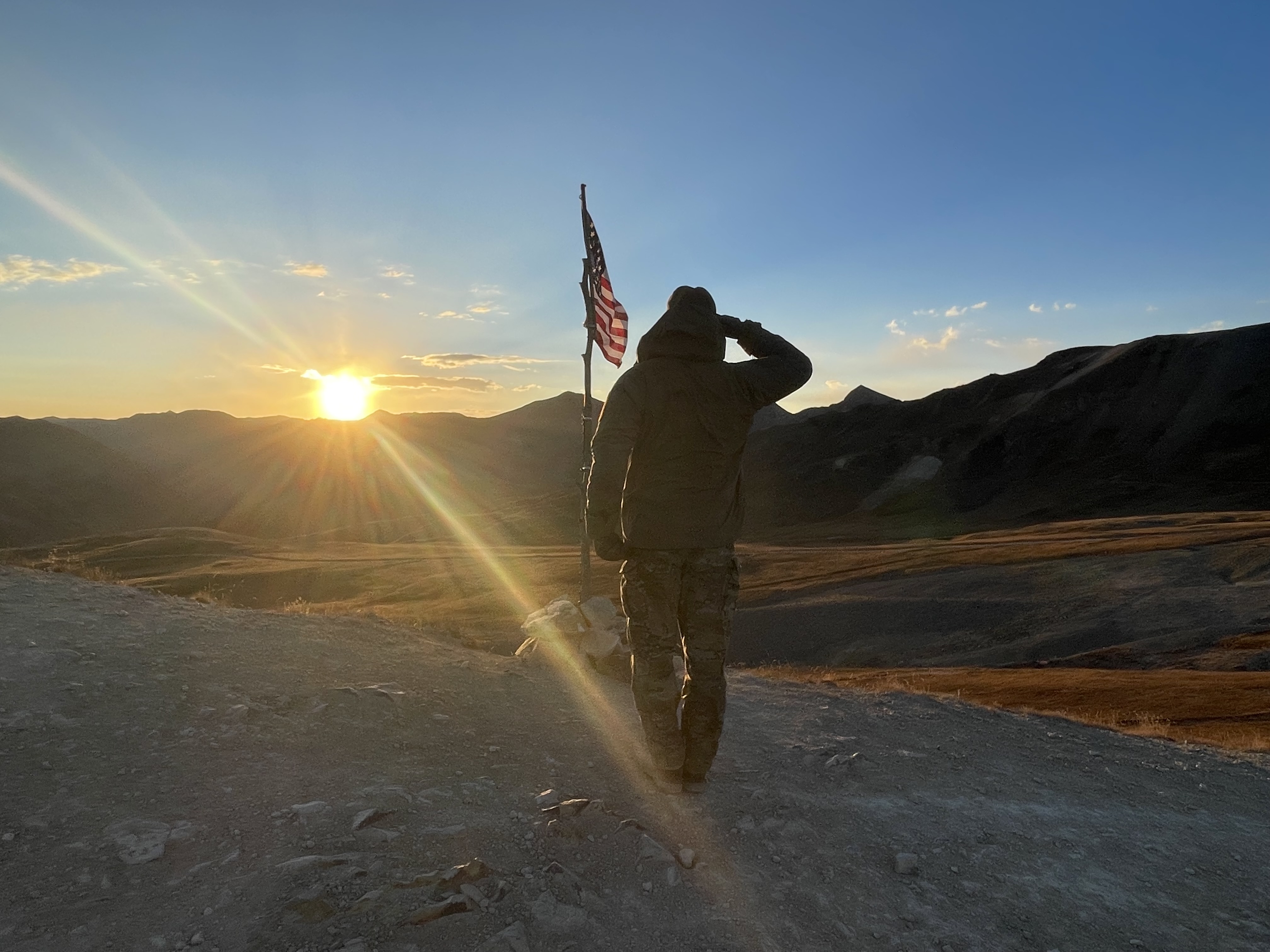 Every weekend, U.S. Army veteran Jimmy Keene II, of Silverton, changes out the American flag which stands sentinel over the San Juan Mountain range. (Carol McKinley/Denver Gazette)