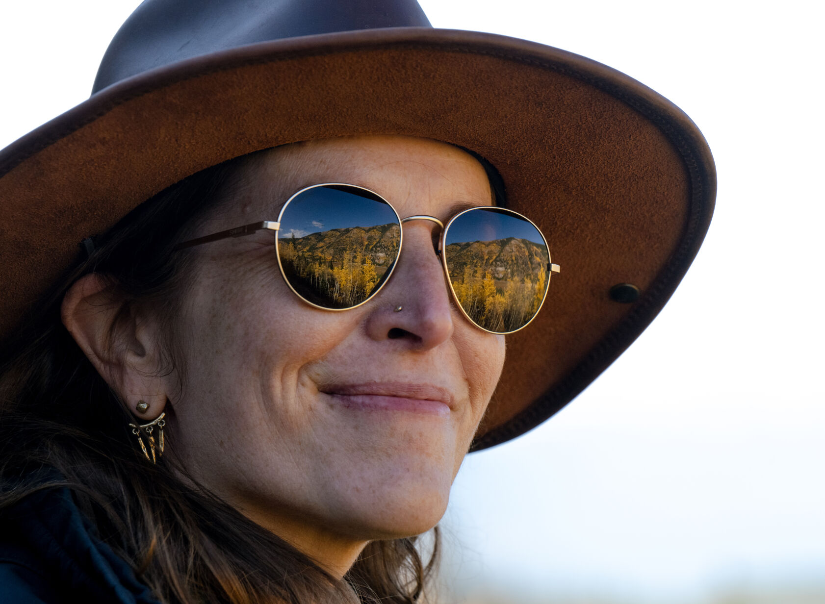 Susan Zumergrad looks out at the changing aspens from a scenic ride on the Leadville Railroad last month. (Parker Seibold, The Gazette)