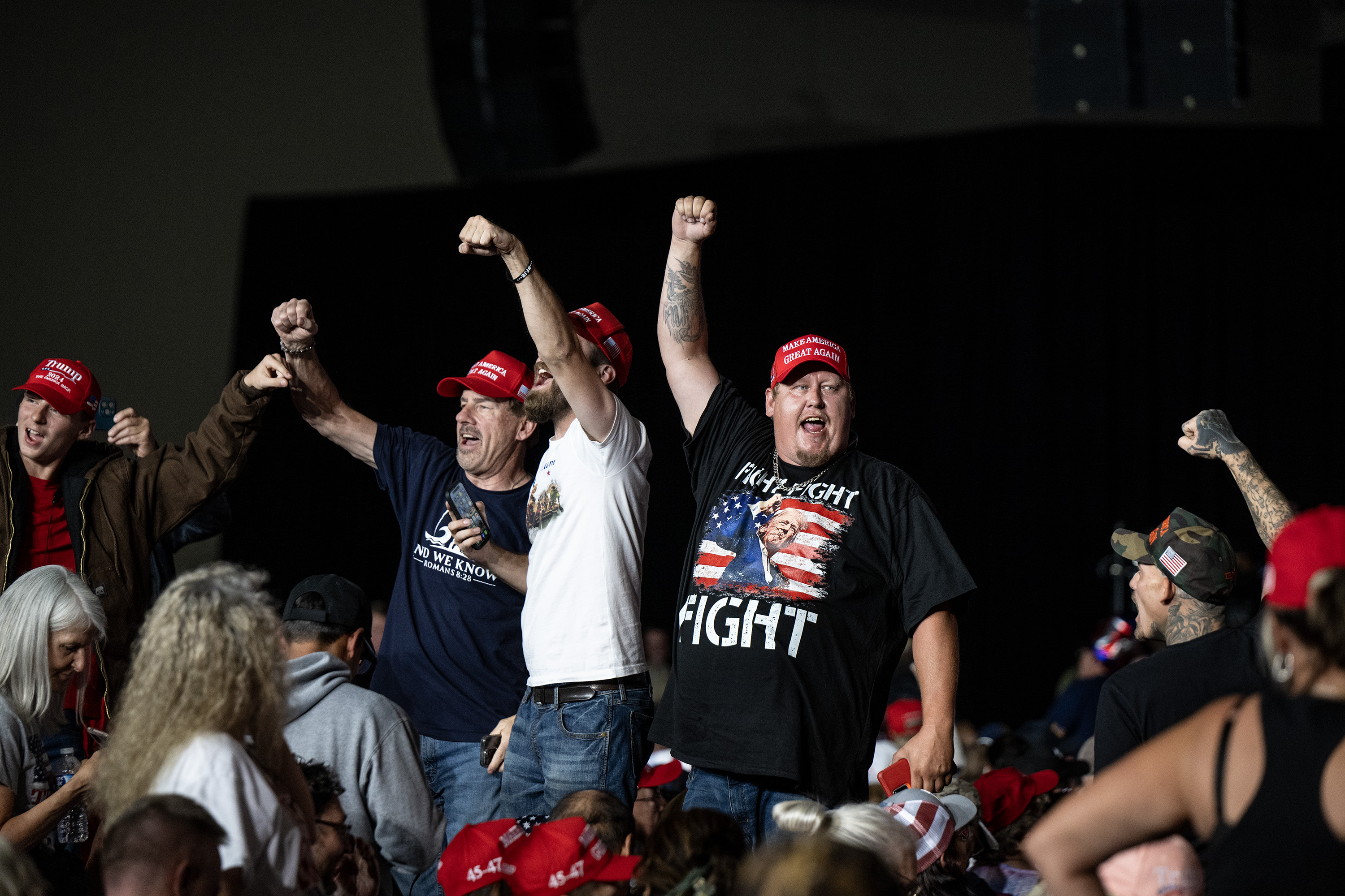 A group of former President Donald Trump supporters cheer “fight” during his campaign rally at the Gaylord Rockies Resort and Convention Center, Friday, Oct. 11, 2024, in Aurora, Colo. (Parker Seibold, The Gazette) (Parker Seibold, The Gazette)
