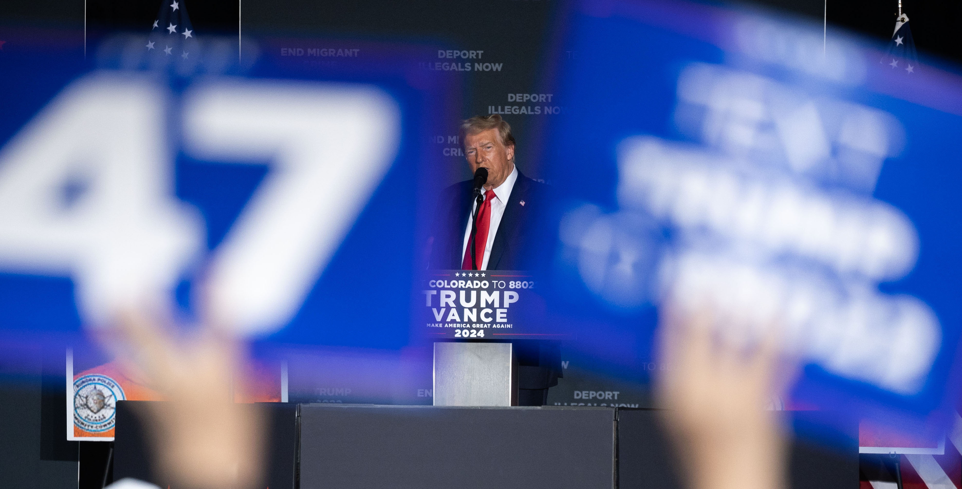 The crowd cheers and waves signs and phones as Trump takes the stage during a political rally at the Gaylord Rockies Resort and Convention Center in Aurora on Friday, Oct. 11, 2024. (Stephen Swofford, Denver Gazette) (Stephen Swofford, Denver Gazette)