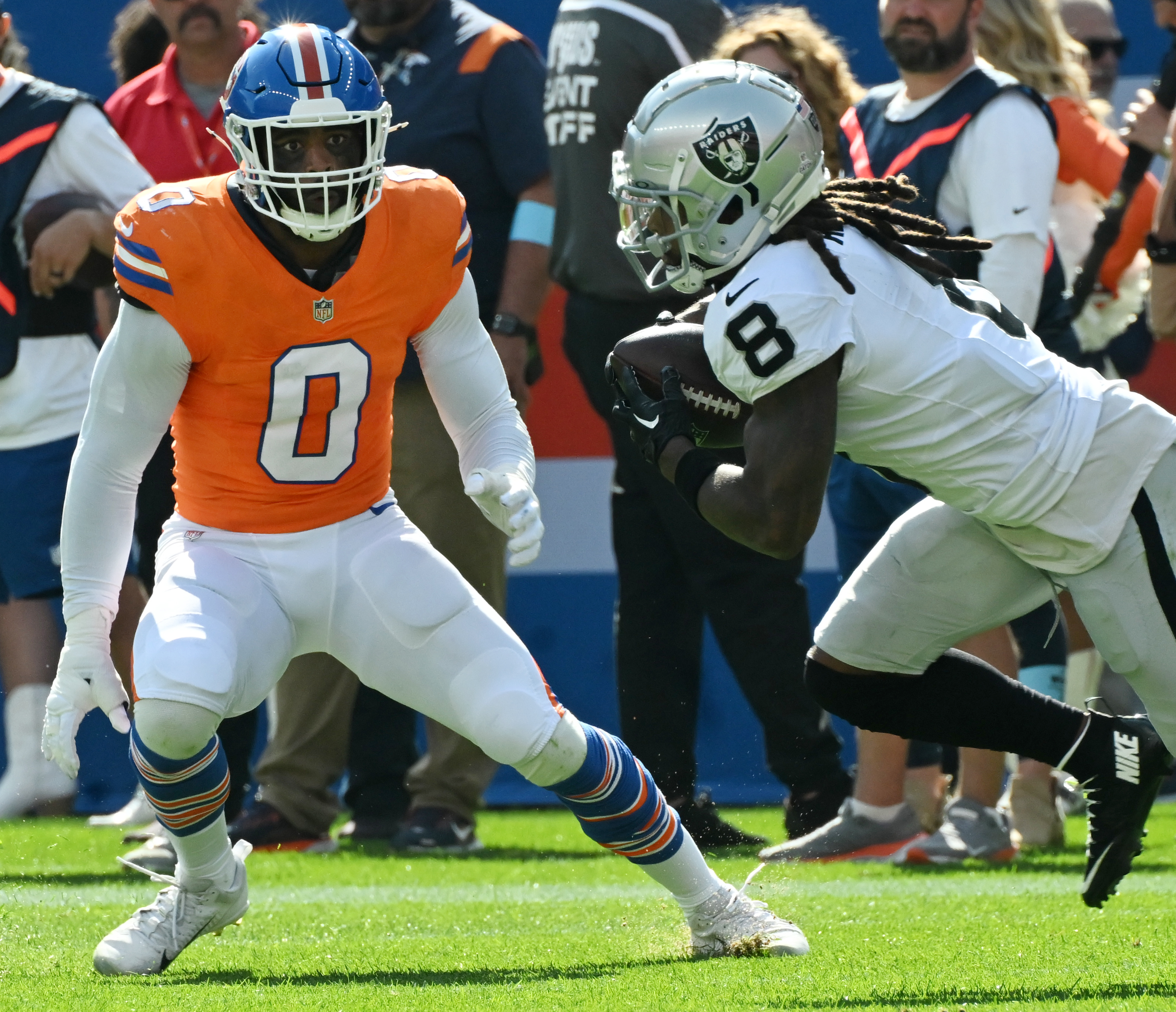 Denver Broncos linebacker Jonathon Cooper (0) goes after Las Vegas Raiders running back Ameer Abdullah (8) during a game against the Raiders at Empower Field at Mile High on Sunday, Oct. 6, 2024.