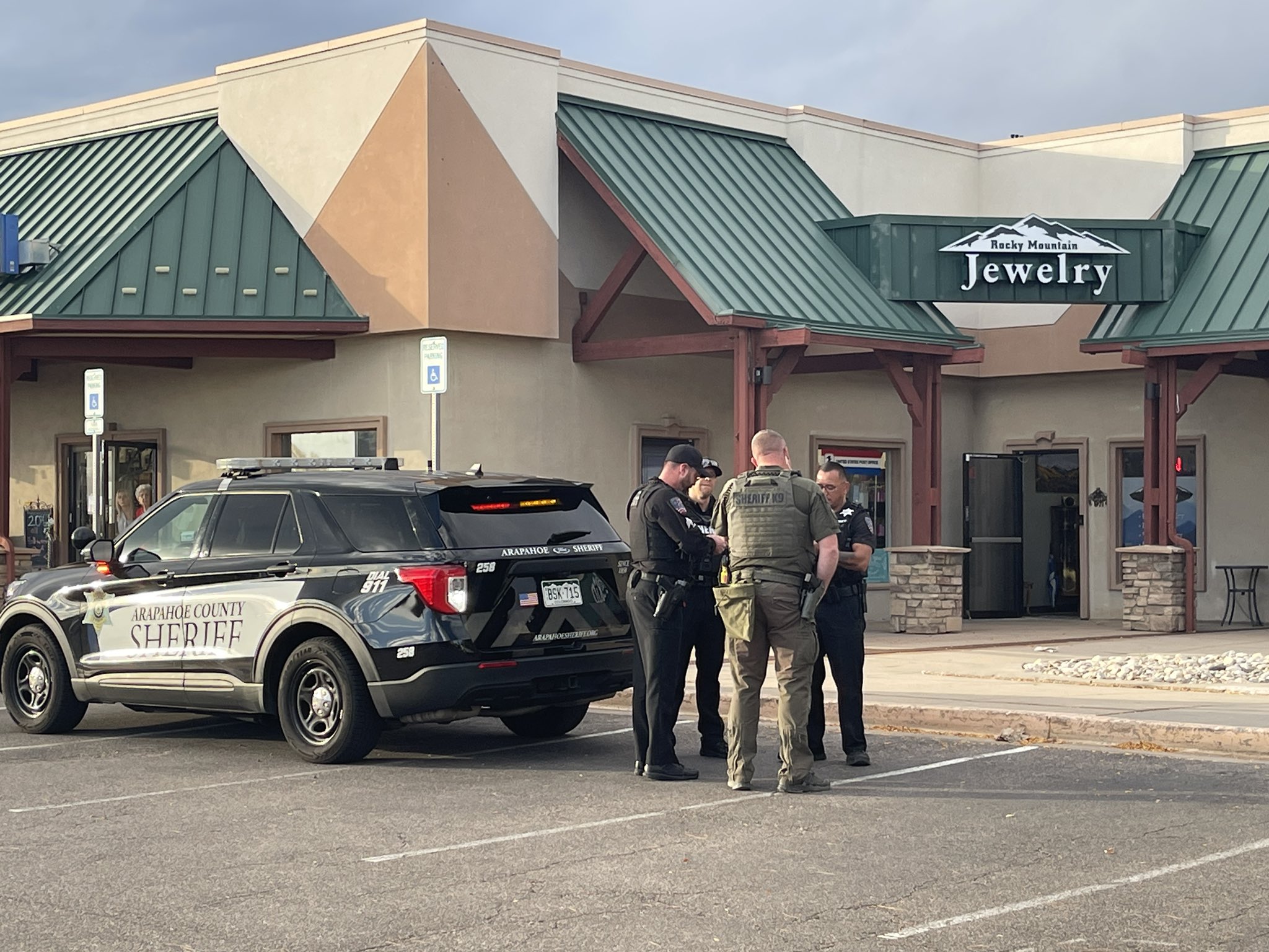 Arapahoe County Sheriff's Office deputies stand outside Rocky Mountain Jewelry, where a robbery took place on Monday, Oct. 28 in Centennial, Colorado. (Courtesy photo, Arapahoe County Sheriff's Office)