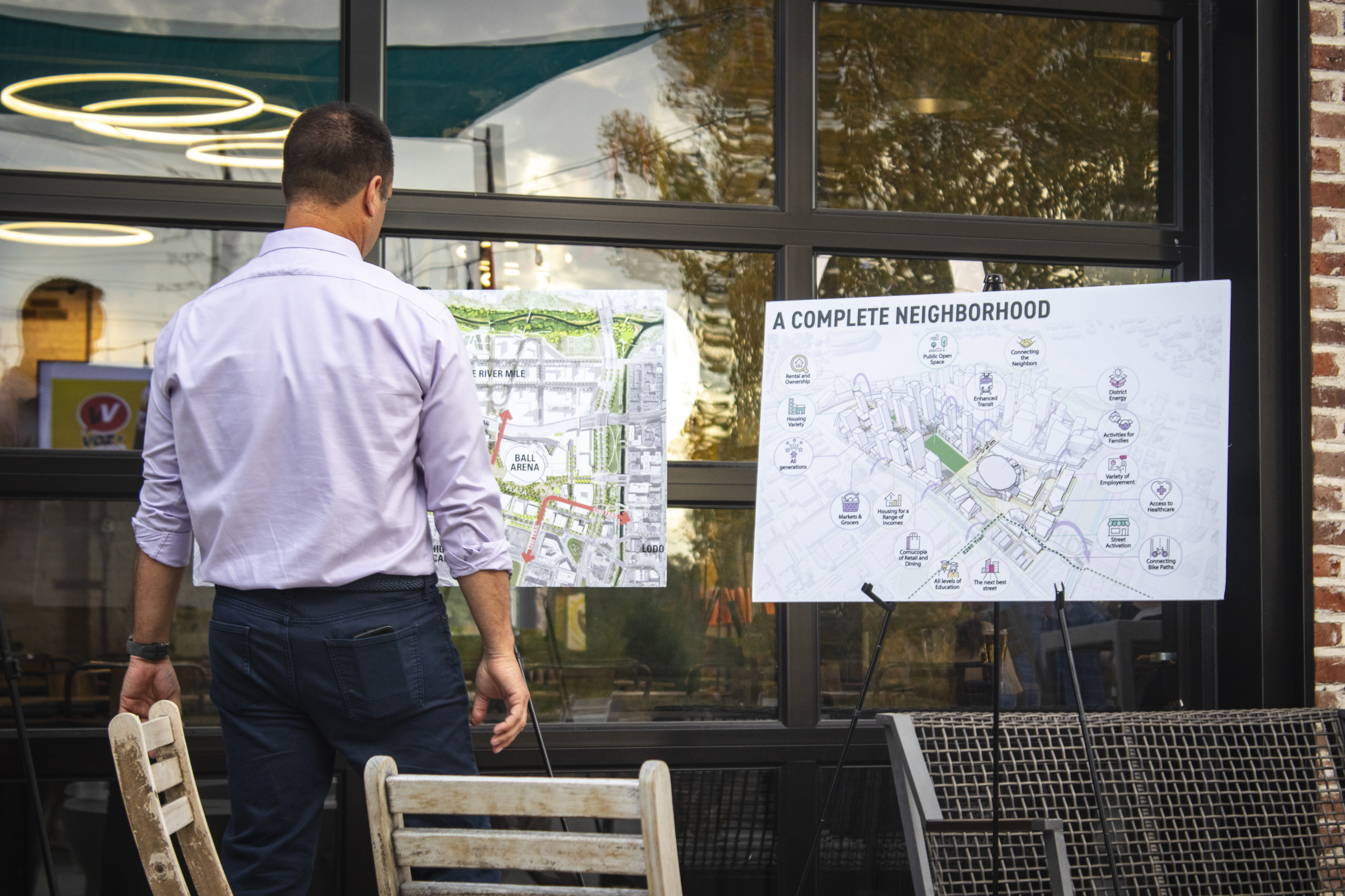 Matt Mahoney of Kroenke Sports & Enterntainment looks at map of the Ball Arena and River Mile development on display at Raíces Brewing Co. on Wednesday, Oct. 16, 2024. (Bernadette Berdychowski / Denver Gazette)