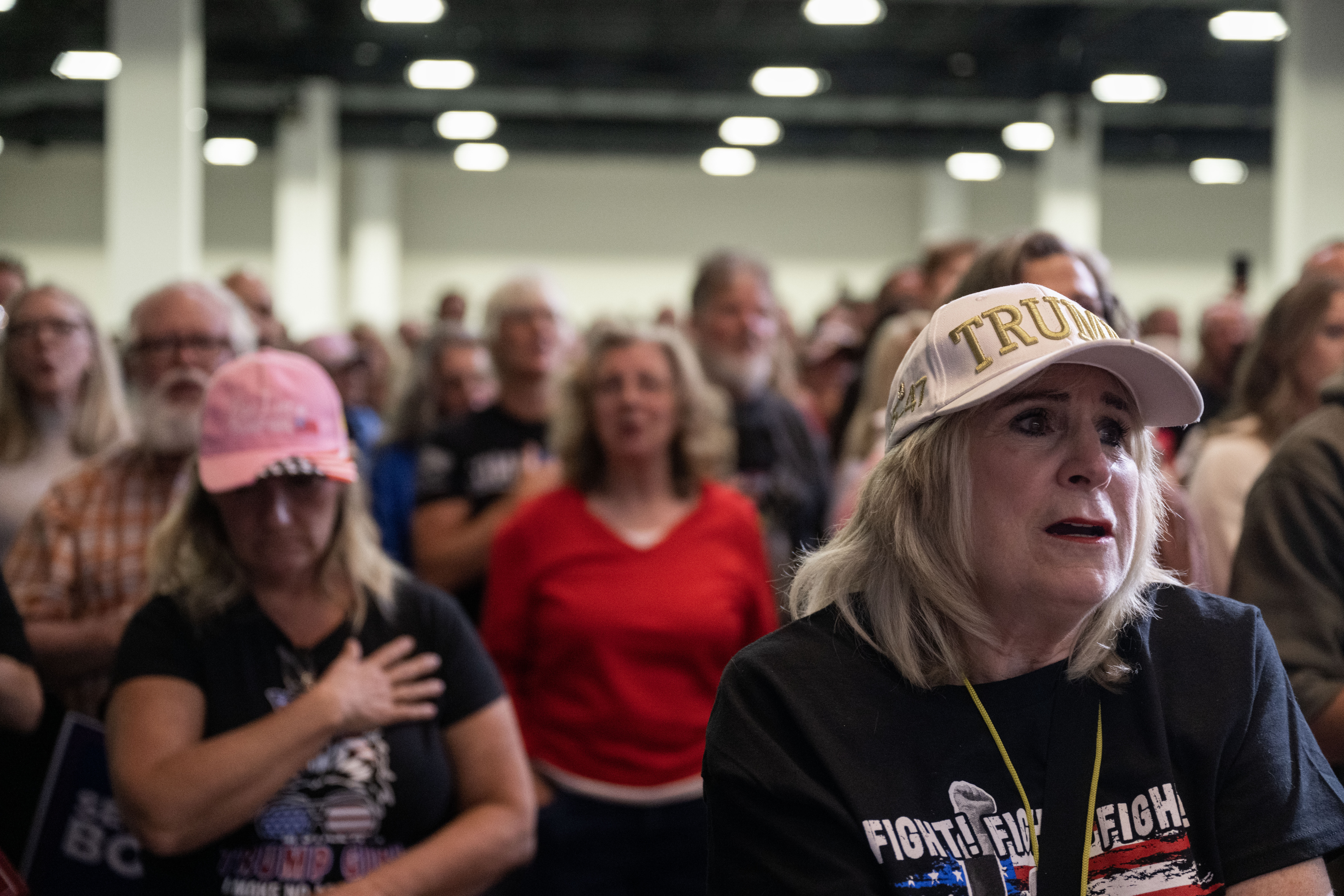 Deborah Gamber sings along to the national anthem during a trump rally at the Gaylord Rockies Resort and Convention Center in Aurora on Friday, Oct. 11, 2024. (Stephen Swofford, Denver Gazette) (Stephen Swofford Denver Gazette)