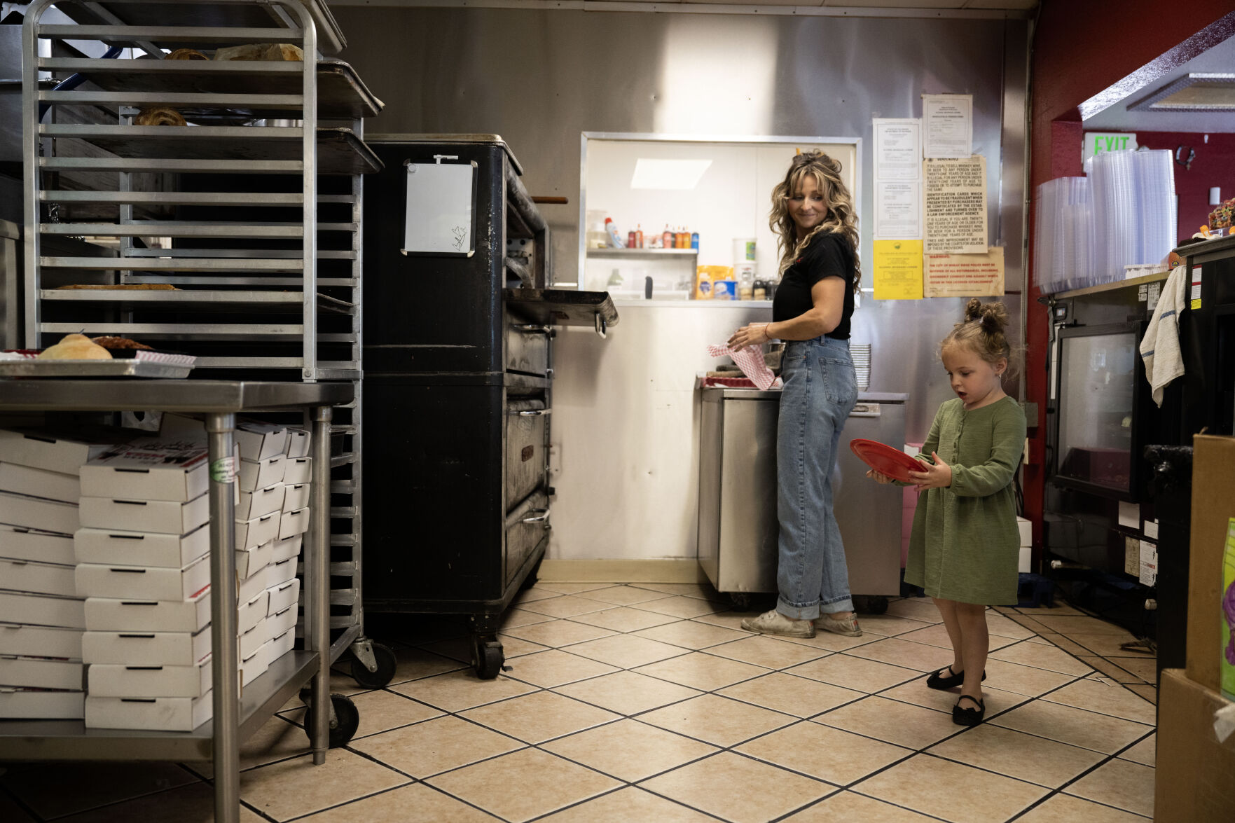 Joeylyn Corder, left, and her niece, Ellie Jo Corder, 4, carry food and plates to a customer’s table as they work at Grammy’s Goodies in Wheat Ridge on Thursday, Oct. 3. (StephenSwoffordPhotographerstephen.swofford@gazette.comhttps://secure.gravatar.com/avatar/1ddcaf11c5d70eaa58546ddc4e038687?d=mm&r=g)