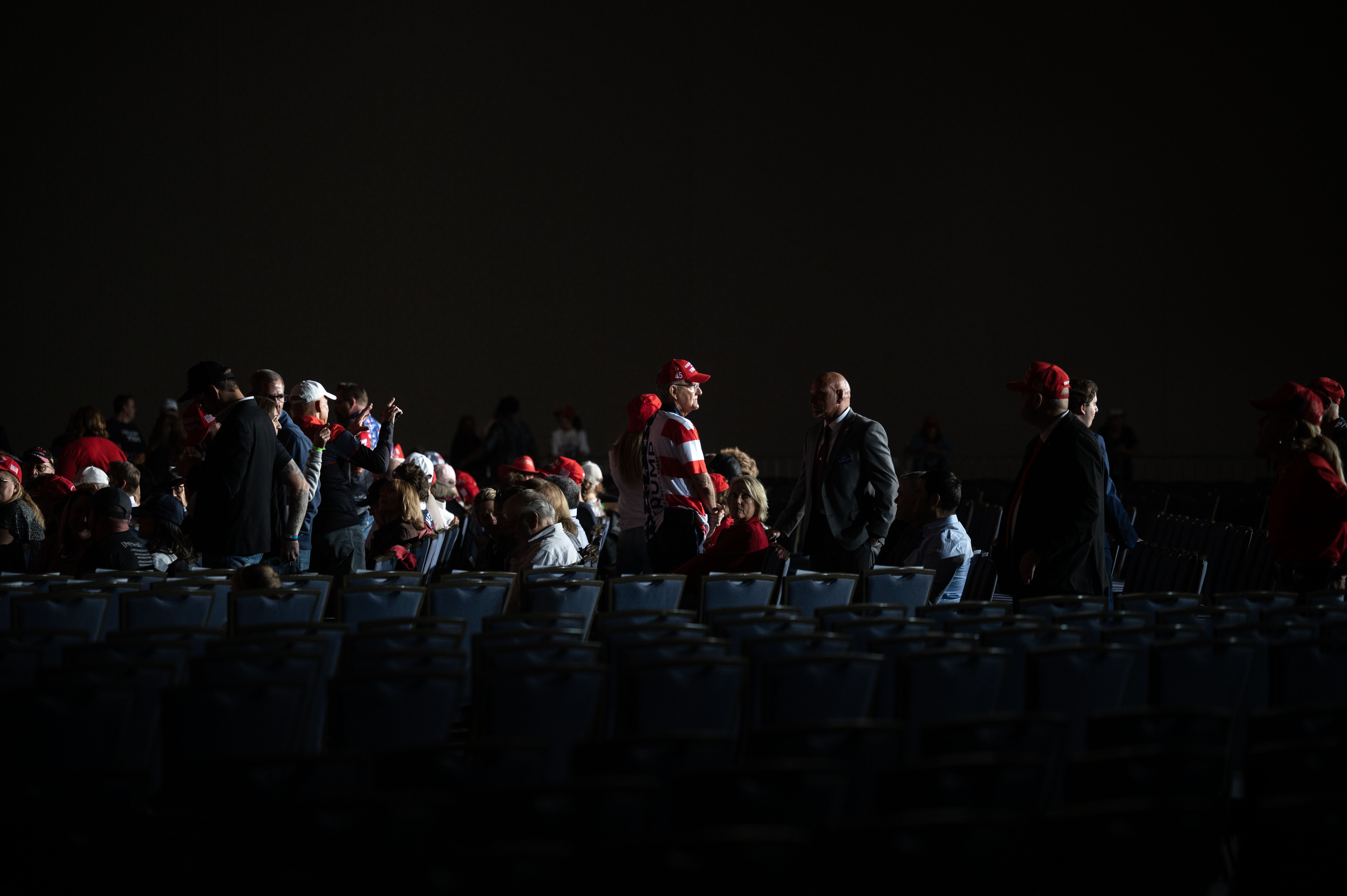 People find their seats near the stage before the start a trump rally at the Gaylord Rockies Resort and Convention Center in Aurora on Friday, Oct. 11, 2024. (Stephen Swofford, Denver Gazette) (Stephen Swofford, Denver Gazette)