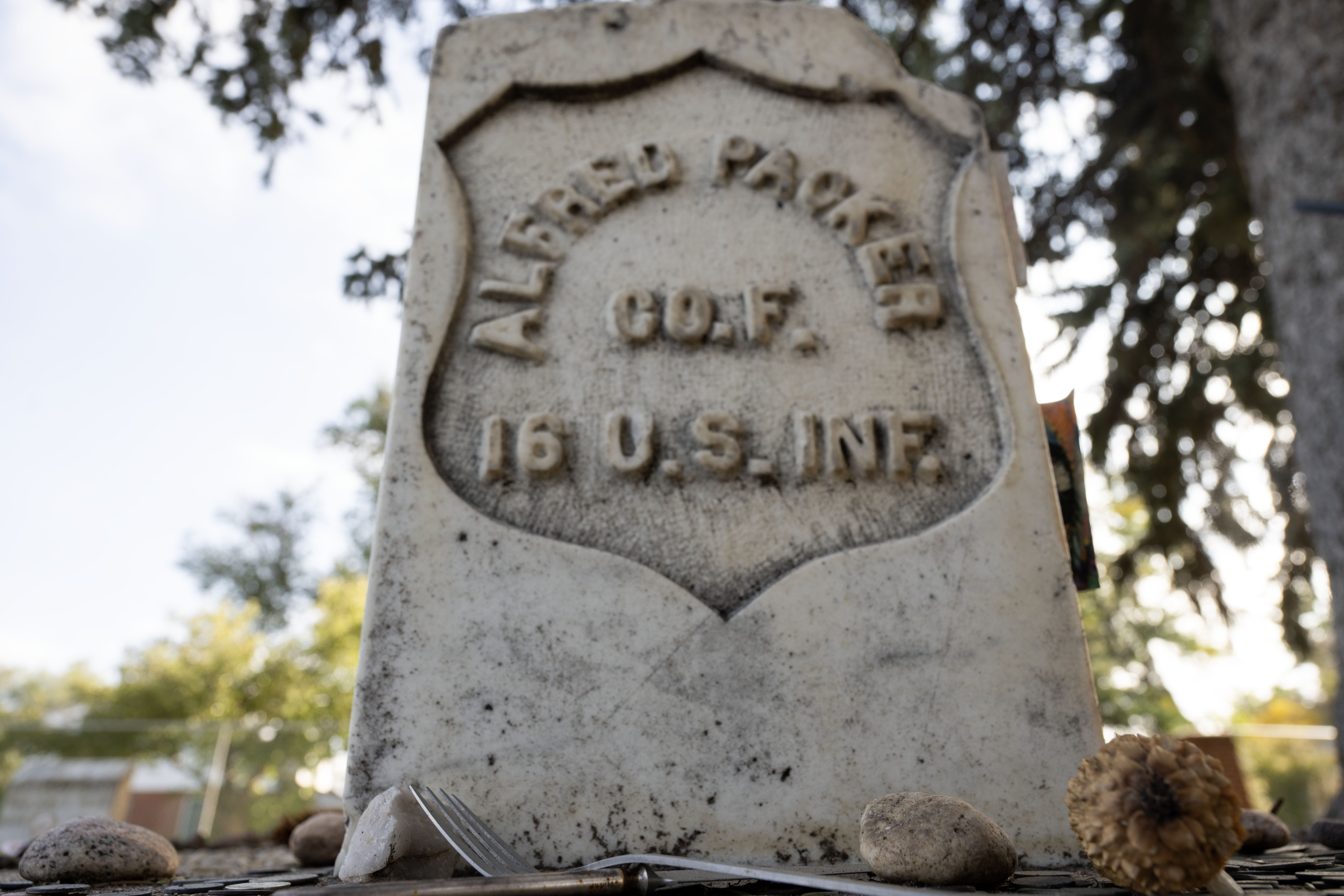 Alfred Packer is the only man in US History to be convicted of a crime related to Cannibalism. His headstone lies in the Littleton Cemetery, where people leave coins and trinkets such as silverware, painted stones, and occasionally chicken bones. (Stephen Swofford, Denver Gazette) (Stephen Swofford Denver Gazette)