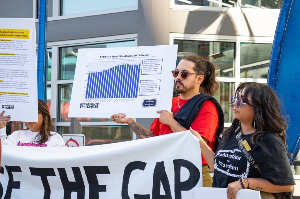State Rep. Tim Hernandez and Jessica Godínez, wellness program manager at Movimiento Poder, protest expected school closures outside of Denver Public Schools on Monday Oct. 21, 2024. (Courtesy photo)