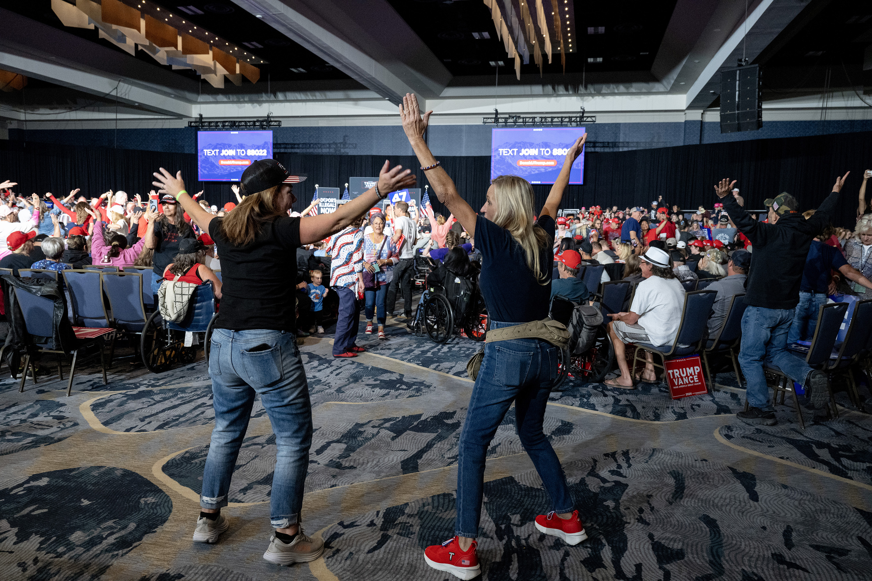 Two women dance at a campaign rally for former President Donald Trump at the Gaylord Rockies Resort and Convention Center, Friday, Oct. 11, 2024, in Aurora, Colo. (Parker Seibold, The Gazette) (Parker Seibold, The Gazette)