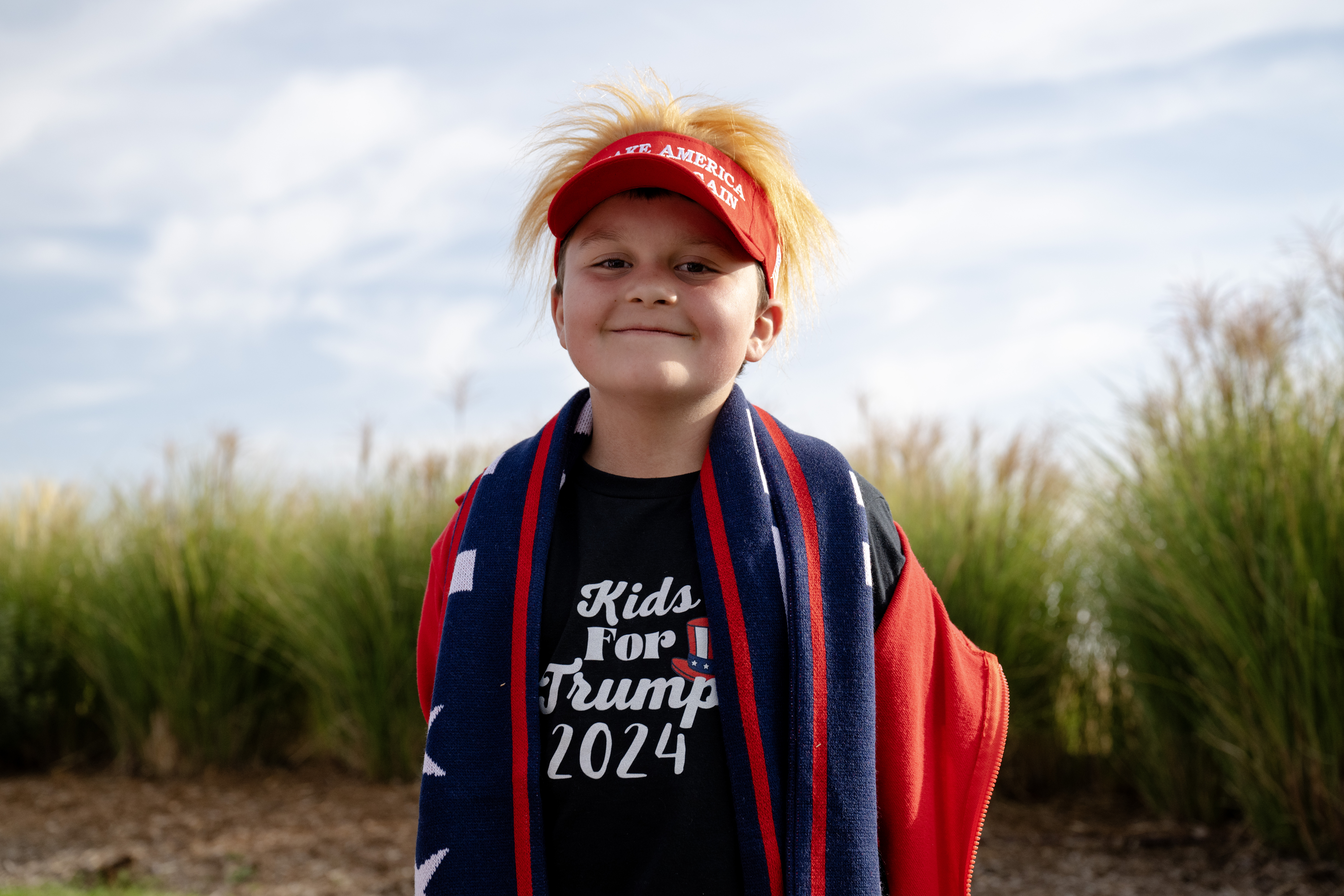 Eight-year-old Mason Kluge, of Evergreen, waits in line at a Trump campaign rally at the Gaylord Rockies Resort and Convention Center, Friday, Oct. 11, 2024, in Aurora, Colo. (Parker Seibold, The Gazette) (Parker Seibold, The Gazette)