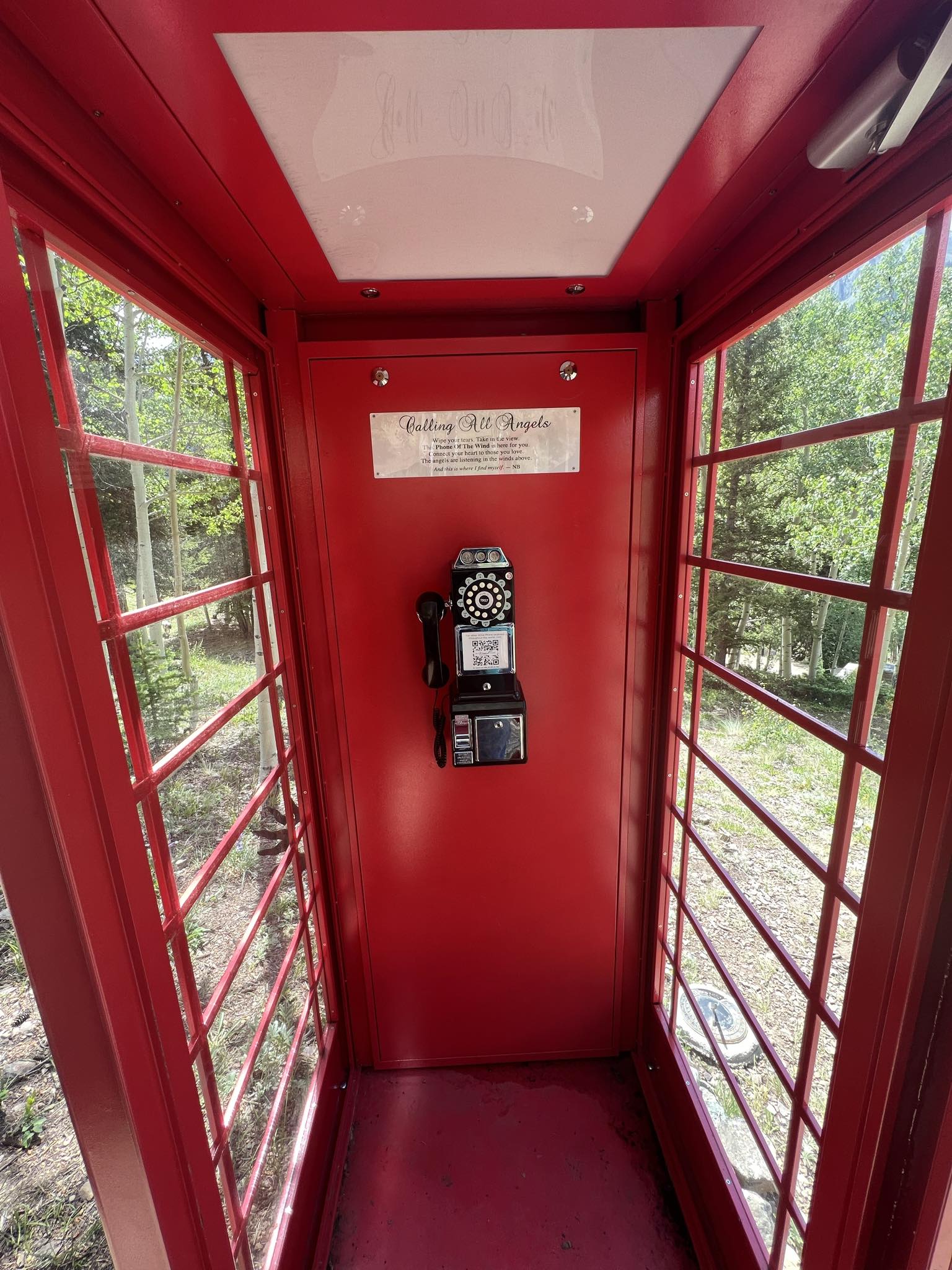 Inside Nancy Brockman's red British-style phone booth is a rotary phone and a sign which invites mourners to call all angels. (CarolMcKinleyDenver Enterprise Reportercarol.mckinley@gazette.comhttps://denvergazette.com/content/tncms/avatars/5/c3/a0f/5c3a0fbe-1007-11ec-9e18-b7f42cfa4b0f.9565a0ce58866e86bcf18260621c2a46.png)