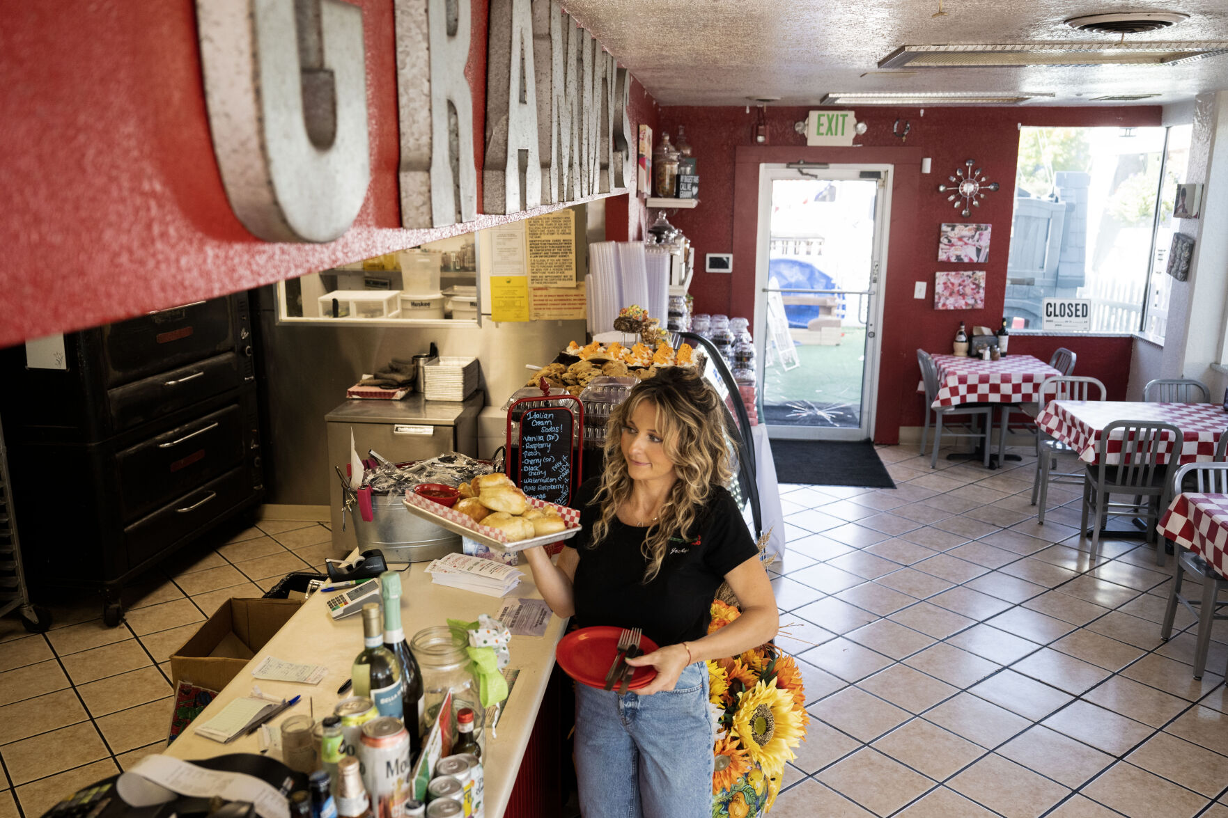 Joeylyn Corder carries a dish to a customer’s table as she works at Grammy’s Goodies in Wheat Ridge this month (StephenSwoffordPhotographerstephen.swofford@gazette.comhttps://secure.gravatar.com/avatar/1ddcaf11c5d70eaa58546ddc4e038687?d=mm&r=g)