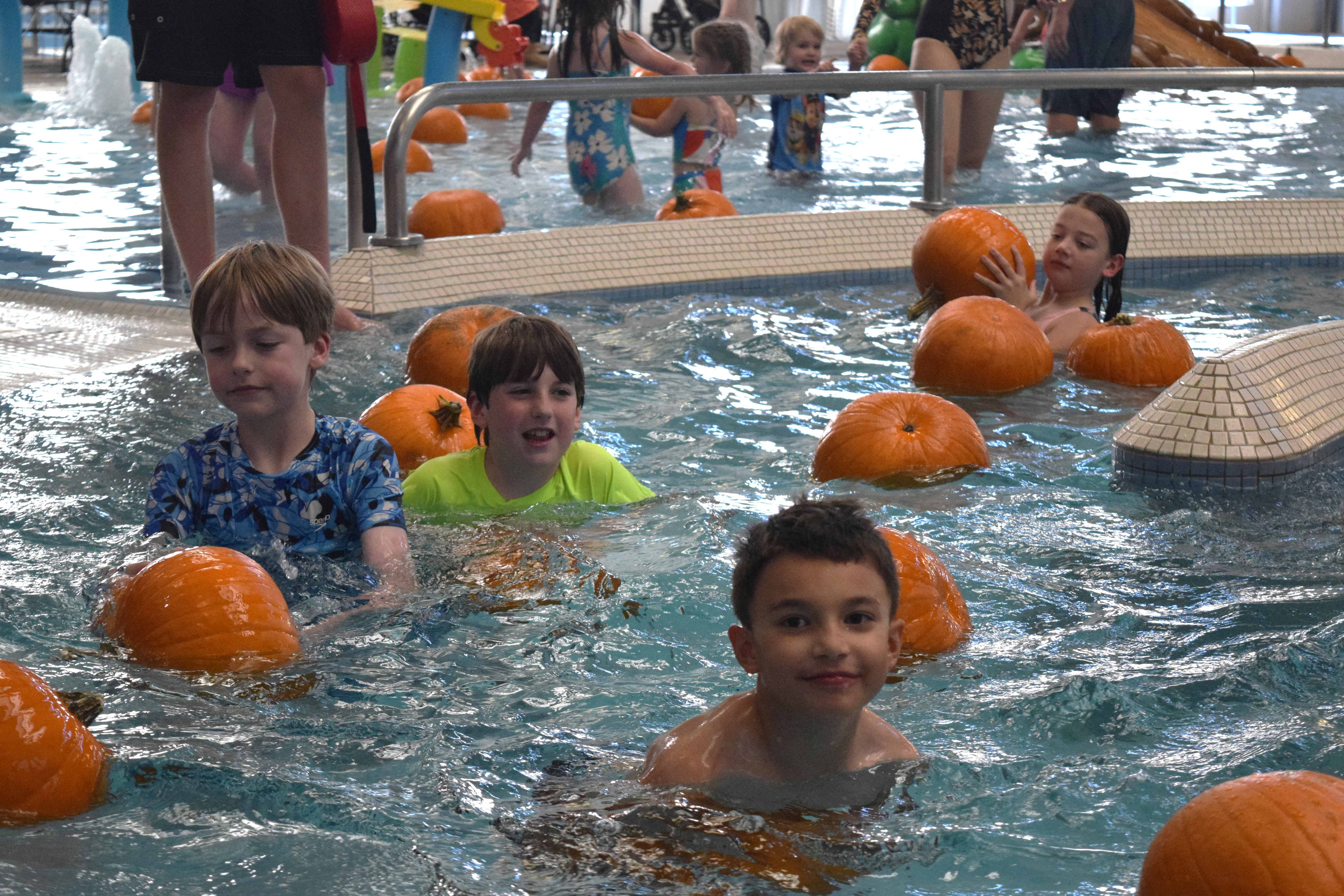 Children dive for Halloween in annual Pumpkin Plunge