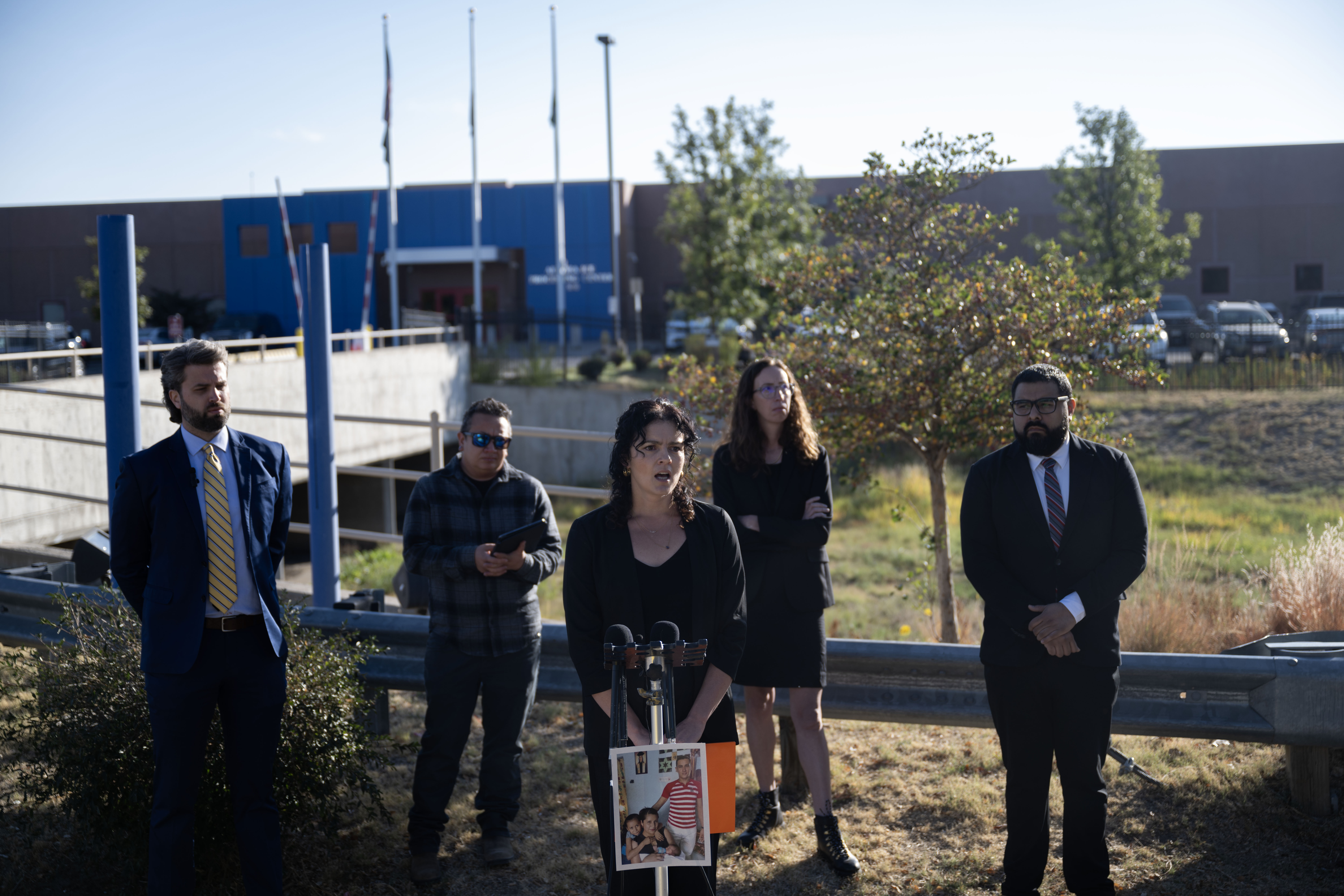 Laura Lunn, with the Rocky Mountain Immigrant Advocacy Network, talks with the media outside the Aurora Contract Detention Facility during a press conference on Tuesday, Oct. 15, 2024 announcing a a wrongful death lawsuit against the facility after Melvin Ariel Calero Mendoza, a 39-year-old Nicaraguan asylum seeker, died in their care two years ago. (Stephen Swofford, Denver Gazette) (StephenSwoffordPhotographerstephen.swofford@gazette.comhttps://secure.gravatar.com/avatar/1ddcaf11c5d70eaa58546ddc4e038687?d=mm&r=g)
