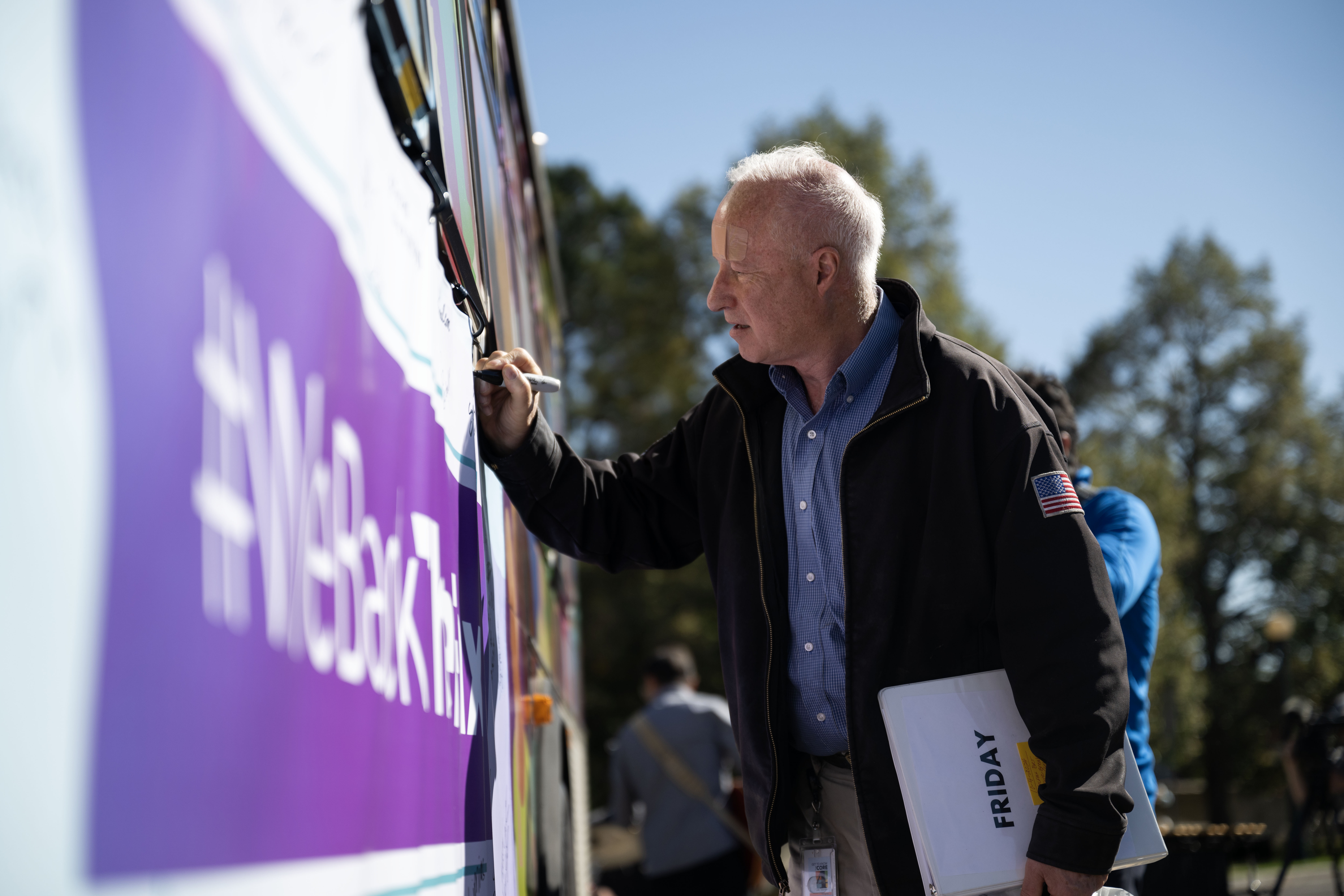 City of Aurora Mayor Mike Coffman signs a banner on the side of a bus during the groundbreaking ceremony on Friday, Oct. 4, 2024 for a $280 million project that will introduce Denver’s first bus rapid transit aimed at transforming how bus service operates on East Colfax Avenue. (Stephen Swofford, Denver Gazette) (StephenSwoffordPhotographerstephen.swofford@gazette.comhttps://secure.gravatar.com/avatar/1ddcaf11c5d70eaa58546ddc4e038687?d=mm&r=g)