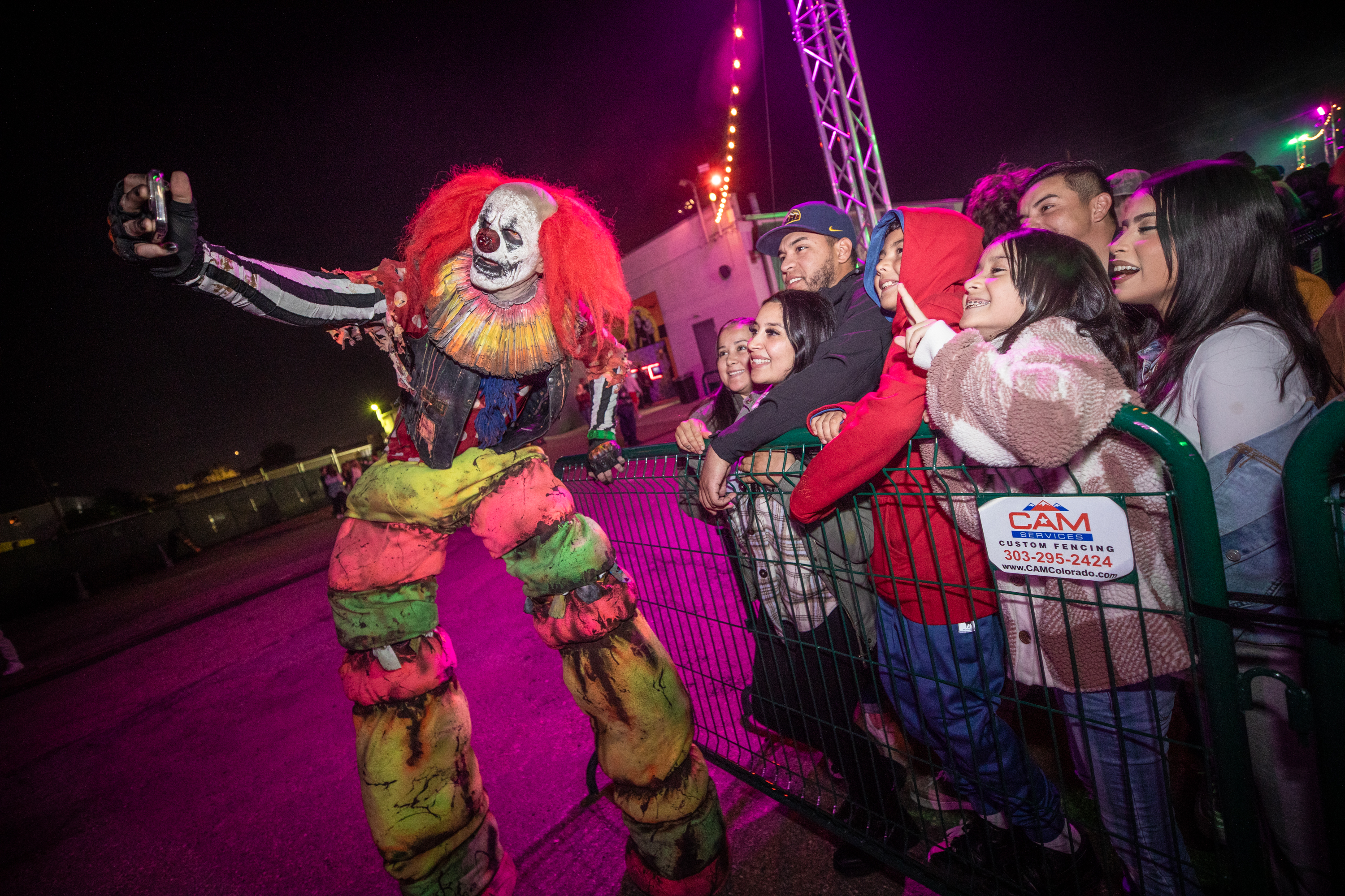 A scare actor poses with visitors to the 13th Floor. (Courtesy photo, 13th Floor)