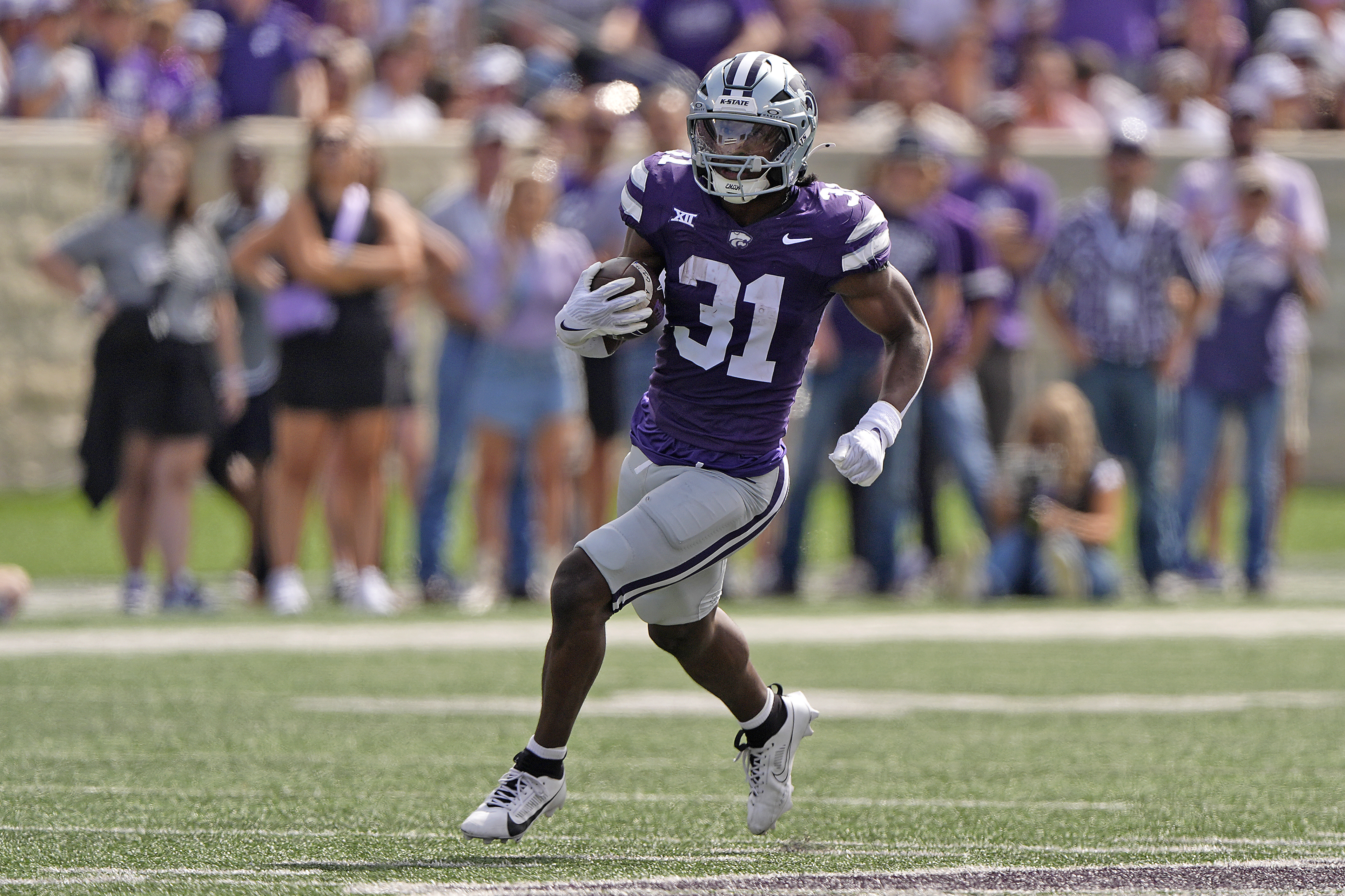 Kansas State running back DJ Giddens runs the ball during the second half of an NCAA college football game against Oklahoma State Saturday, Sept. 28, 2024, in Manhattan, Kan. (AP Photo/Charlie Riedel) (Charlie Riedel)