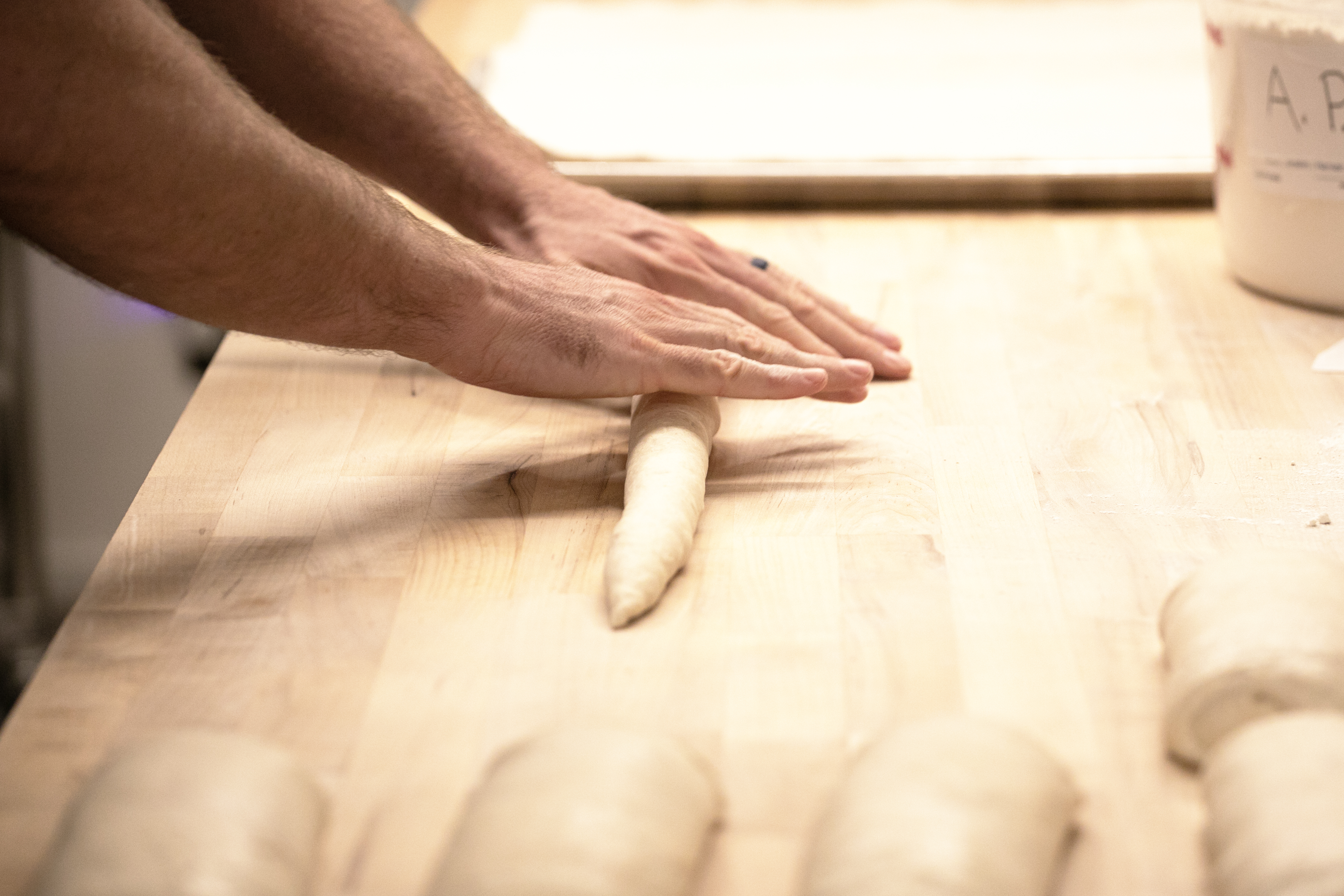 Jeff Nixon shapes bread dough to form baguettes at his cottage bakery, Spruce House Bread, in Centennial, Colo. on Thursday, Sept. 26, 2024. Nixon competed and won in the bread category at least year's inaugural Denver Bake Fest for his five grain