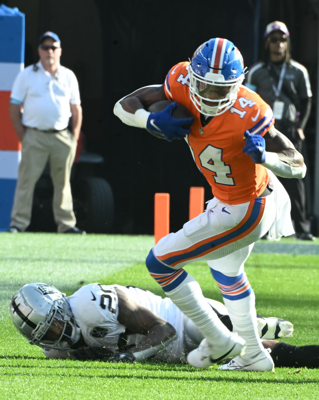 Denver Broncos wide receiver Courtland Sutton (14) leans forward for more yards during the third quarter of a game at Empower Field at Mile High on Sunday, Oct. 6, 2024. The Broncos won the game 34-18. (Jerilee Bennett The Gazette)