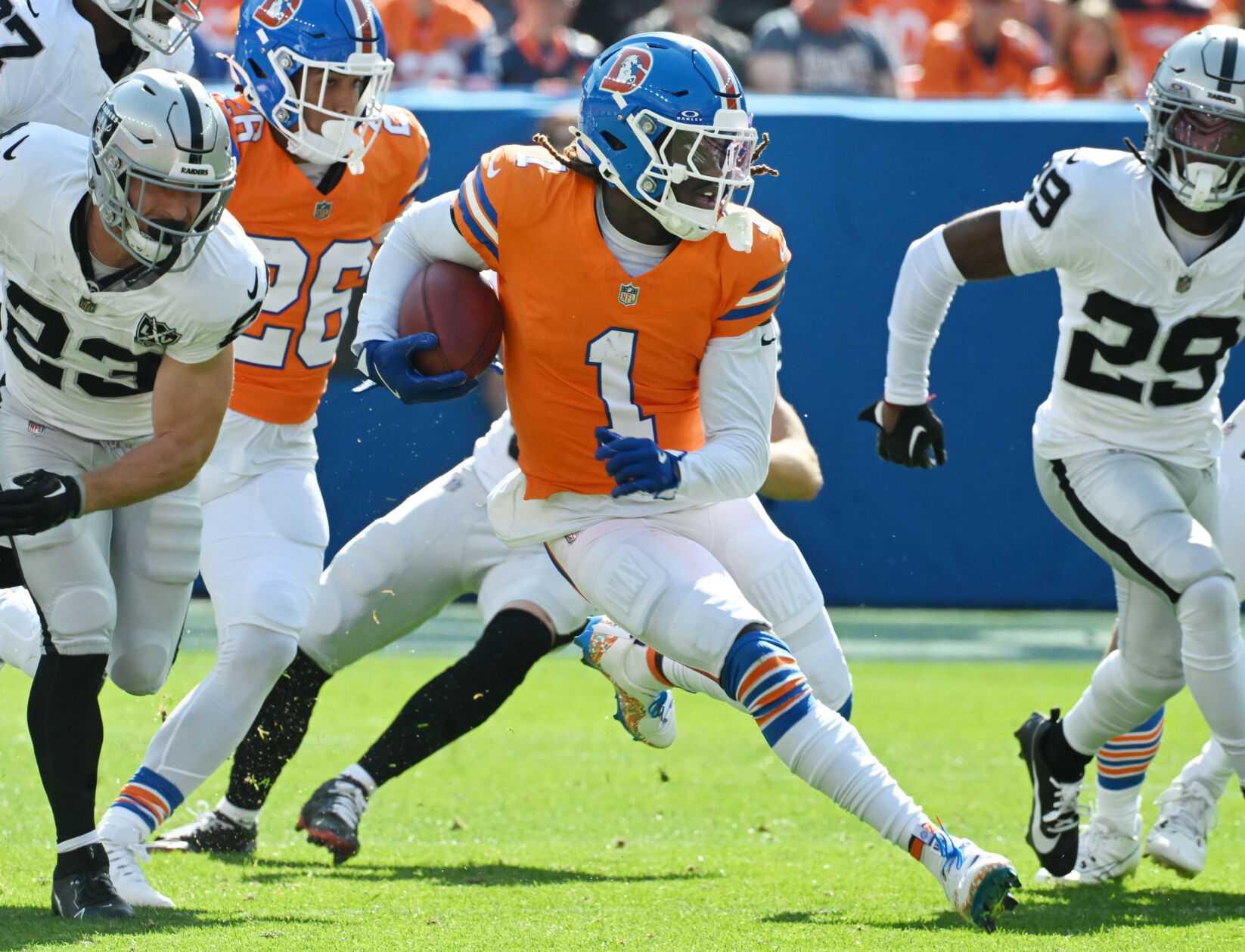 Denver Broncos cornerback Tremon Smith (1) carries the ball after a punt during the first quarter of a game at Empower Field at Mile High on Sunday, Oct. 6, 2024. The Broncos won the game 34-18. (Jerilee Bennett, The Gazette)