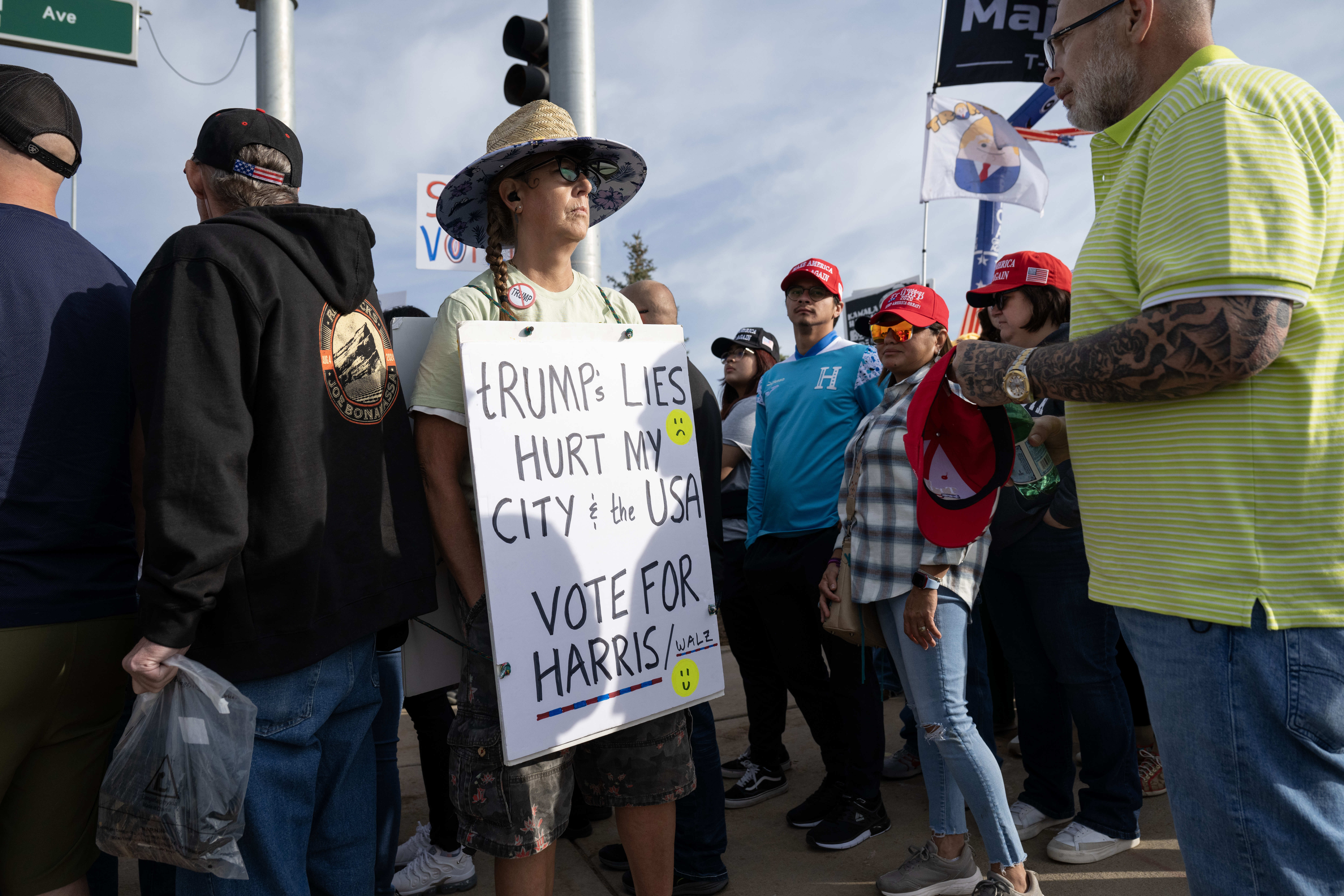 Sara Howell stands in a group of Trump supporters waiting for the Trump campaign rally at the Gaylord Rockies Resort and Convention Center, Friday, Oct. 11, 2024, in Aurora, Colo. Howell lives a few blocks away from the Aurora apartment complex Trump claims has been overtaken by a Venezuelan gang. She says she feels safe in her neighborhood and is tired of Trump’s claims about her city. (Parker Seibold, The Gazette) (Parker Seibold, The Gazette)