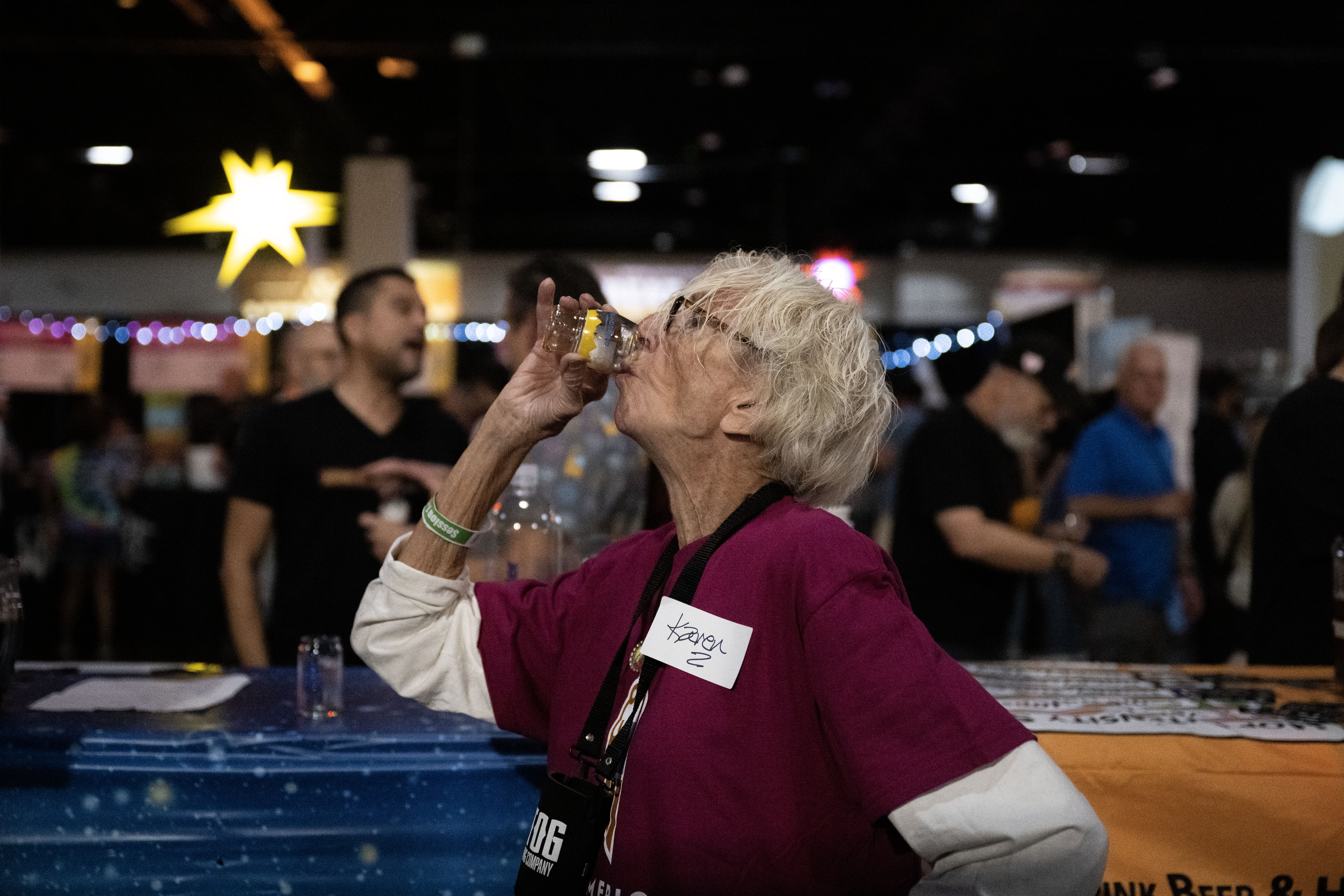 Karen Gruber tastes a beer sample as she volunteers on the opening night of the Great American Beer Festival on Thursday, Oct. 10, 2024 (Stephen Swofford, Denver Gazette) (Stephen Swofford Denver Gazette)