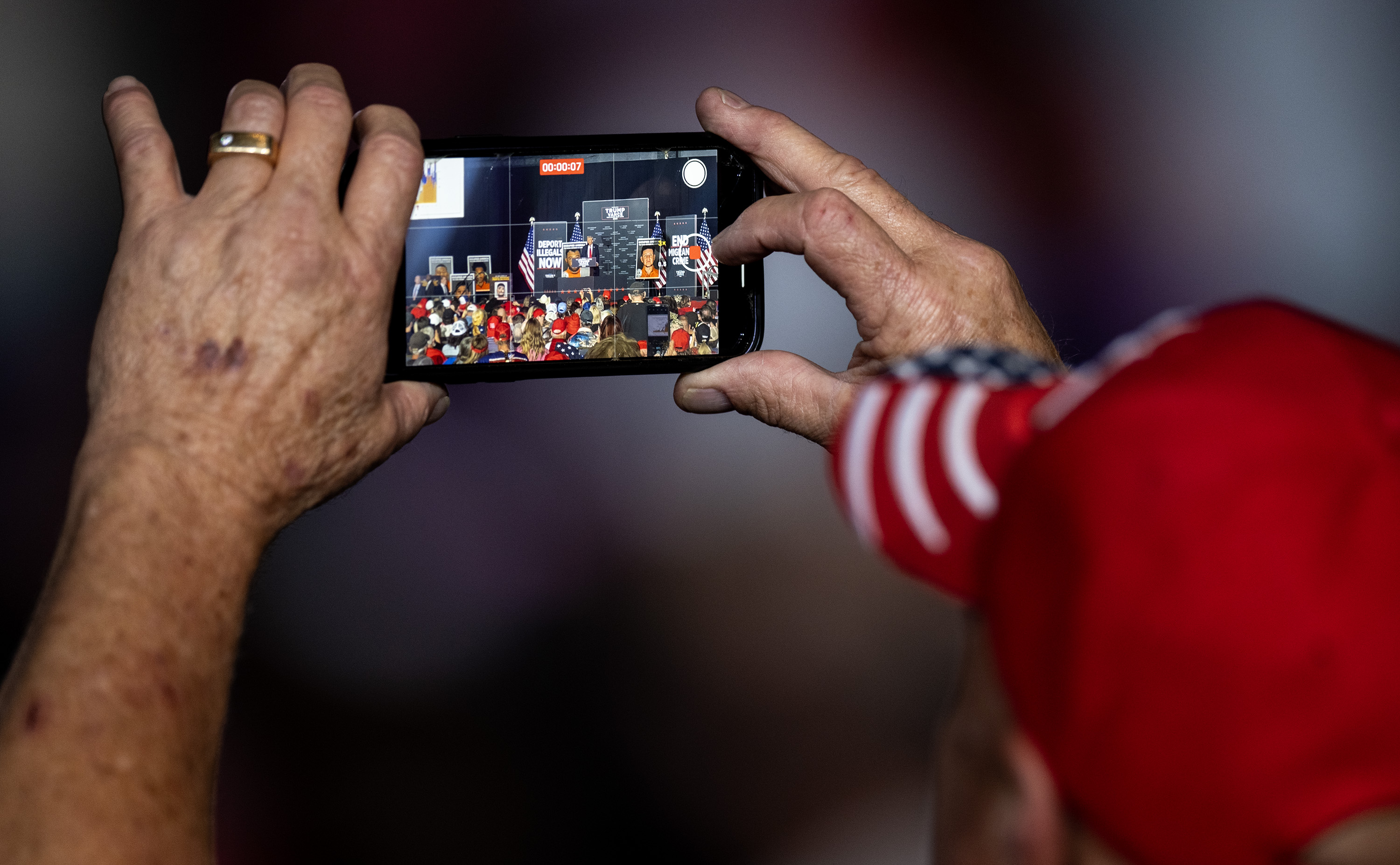 A supporter films Republican presidential nominee former President Donald Trump’s remarks during a campaign rally at the Gaylord Rockies Resort and Convention Center, Friday, Oct. 11, 2024, in Aurora, Colo. (Parker Seibold, The Gazette) (Parker Seibold, The Gazette)