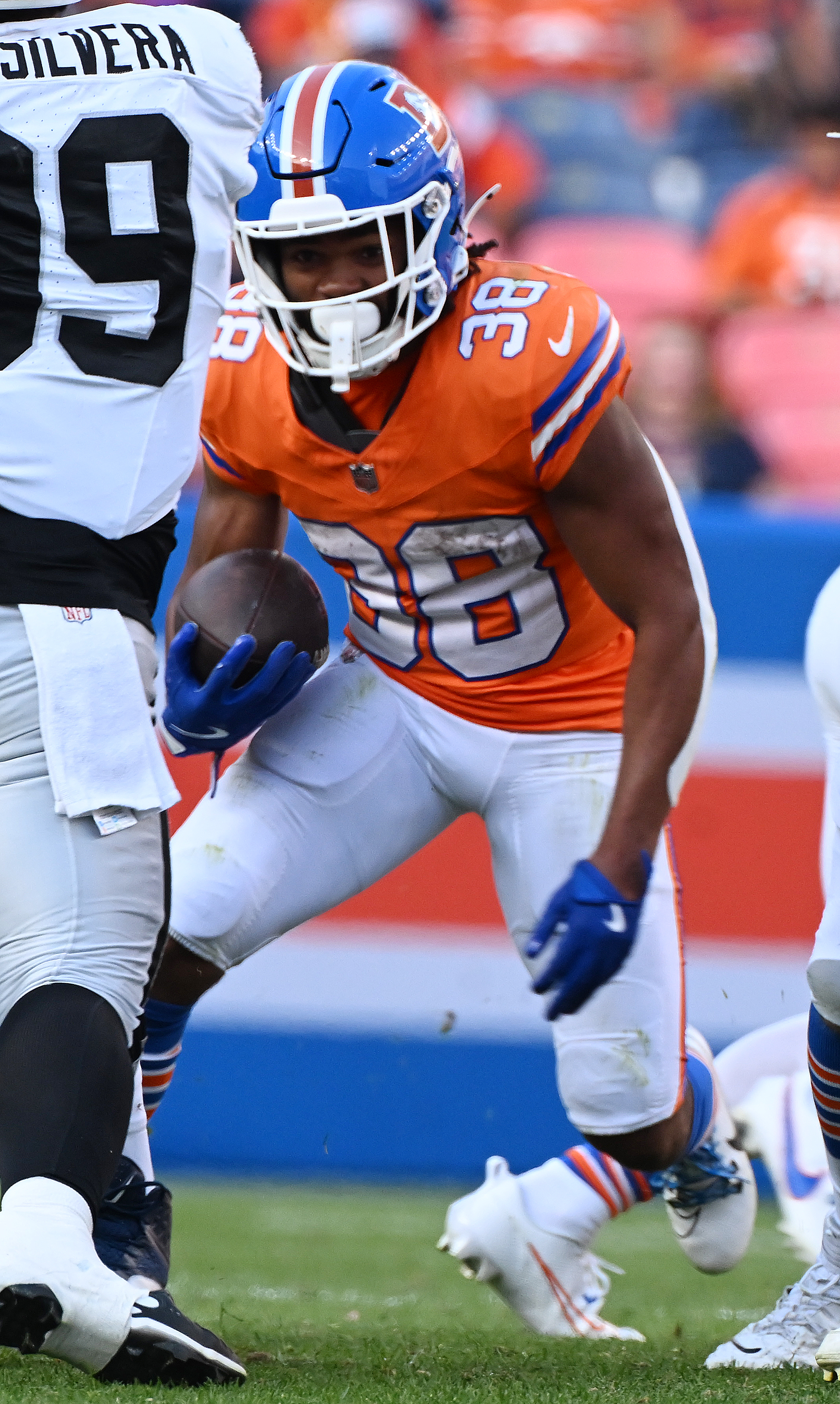 Denver Broncos running back Jaleel McLaughlin (38) carries the ball during a game against the Raiders at Empower Field at Mile High on Sunday, Oct. 6, 2024. (Jerilee Bennett The Gazette)