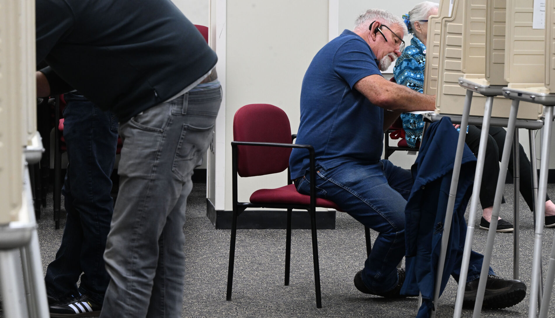 A voter carefully fills out his lengthy ballot. He was voting at the Citizens Service Center on Garden of the Gods Road in Colorado Springs on Oct. 21. (THE denver GAZETTE)