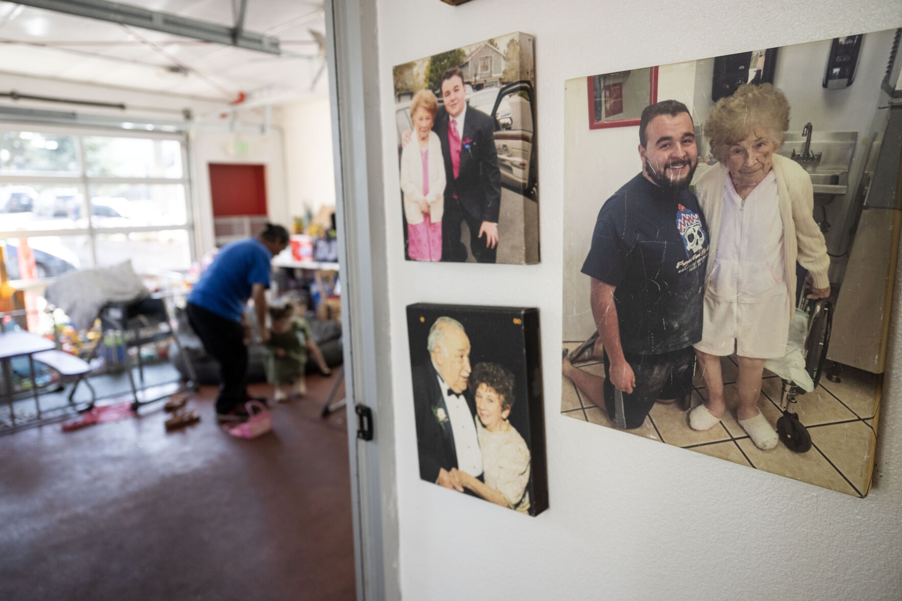 Photos of George Corder with his great-grandmother, who the store is named after, hang on the wall outside the office where George’s kids play during a shift at Grammy’s Goodies in Wheat Ridge this month. (StephenSwoffordPhotographerstephen.swofford@gazette.comhttps://secure.gravatar.com/avatar/1ddcaf11c5d70eaa58546ddc4e038687?d=mm&r=g)