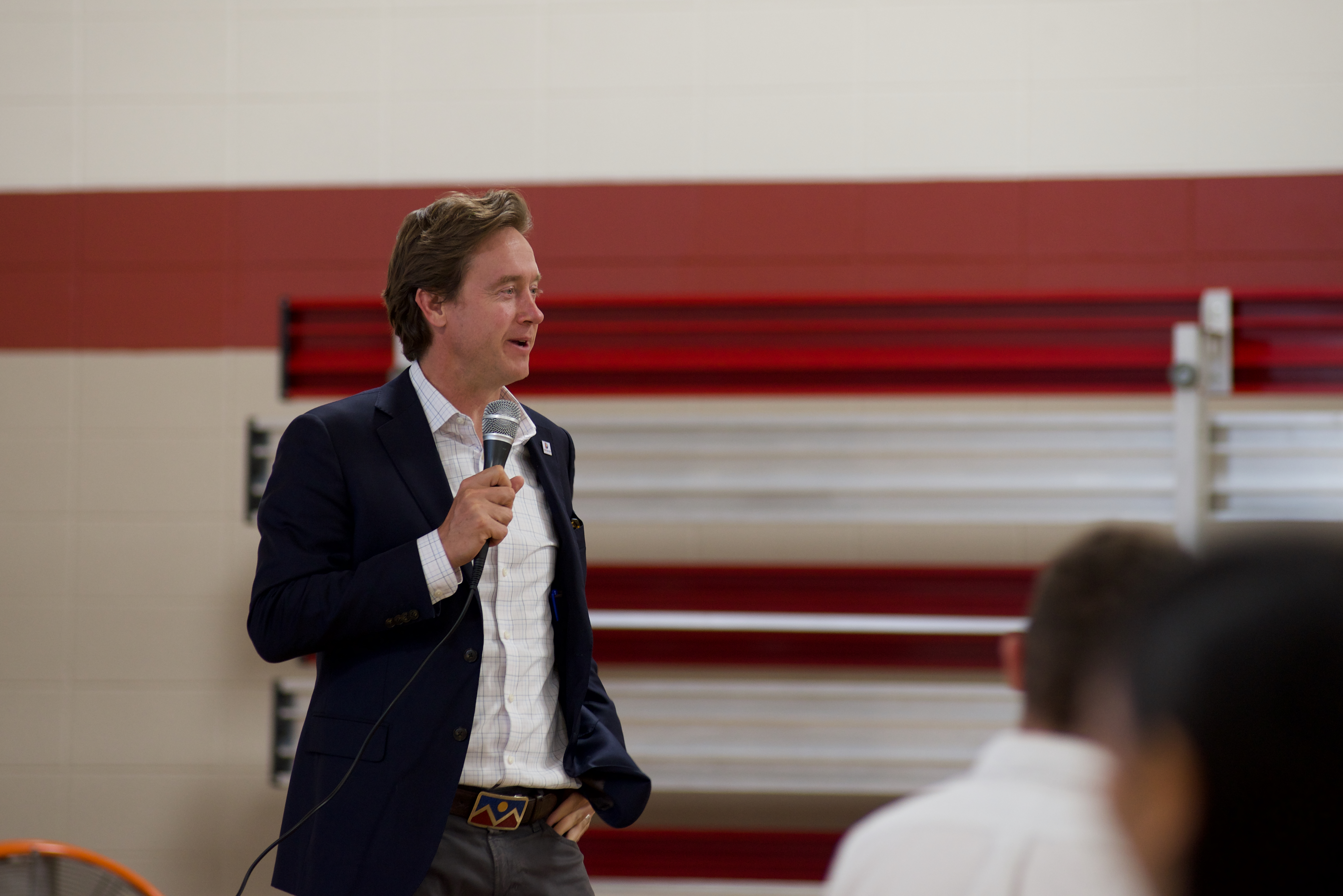 Denver Mayor Mike Johnston addresses the crowd at Glenarm Recreation Center during a community conversation on 