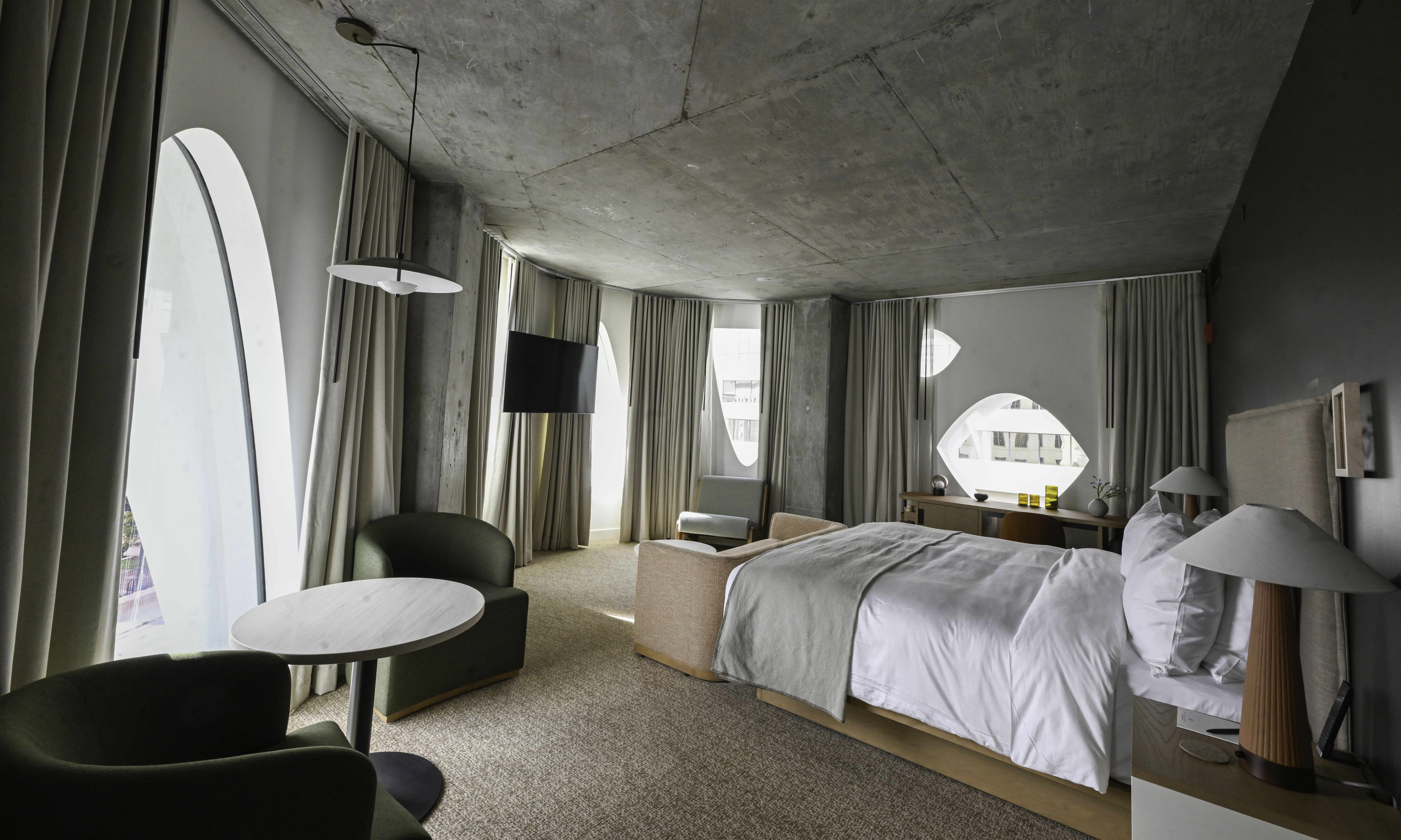 The large eye-shaped windows ring a corner room of the Populus Hotel. (JerileeBennettjerilee.bennett@gazette.comhttps://secure.gravatar.com/avatar/a400b0ac348f1407dc2709999dc38d3b?d=mm&r=g)