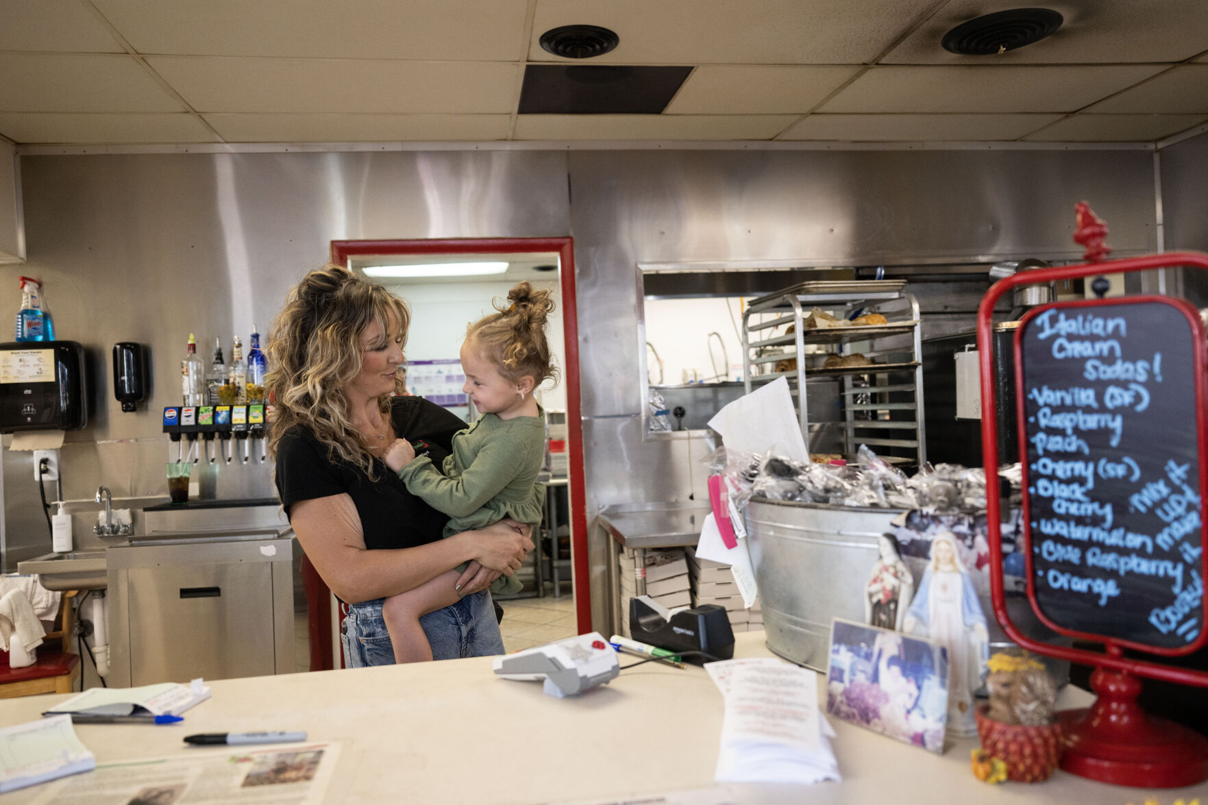Joeylyn Corder, holds her niece, Ellie Jo, 4, as they work behind the counter at Grammy’s Goodies in Wheat Ridge on Thursday, Oct. 3, 2024 (Stephen Swofford, Denver Gazette) (StephenSwoffordPhotographerstephen.swofford@gazette.comhttps://secure.gravatar.com/avatar/1ddcaf11c5d70eaa58546ddc4e038687?d=mm&r=g)
