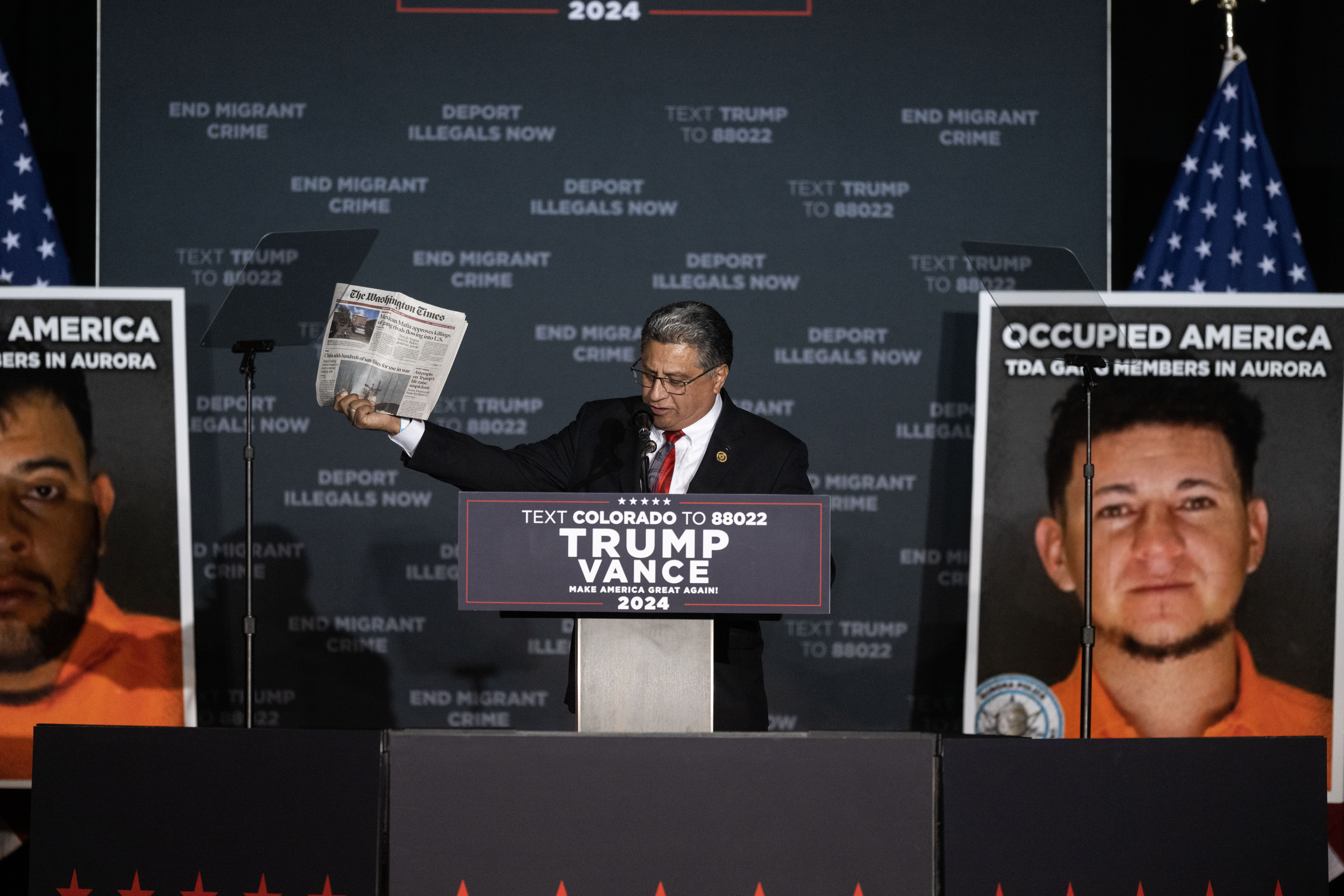 US Representative Greg Lopez holds up a Washington Times paper as he during a trump rally at the Gaylord Rockies Resort and Convention Center in Aurora on Friday, Oct. 11, 2024. (Stephen Swofford, Denver Gazette) (Stephen Swofford Denver Gazette)