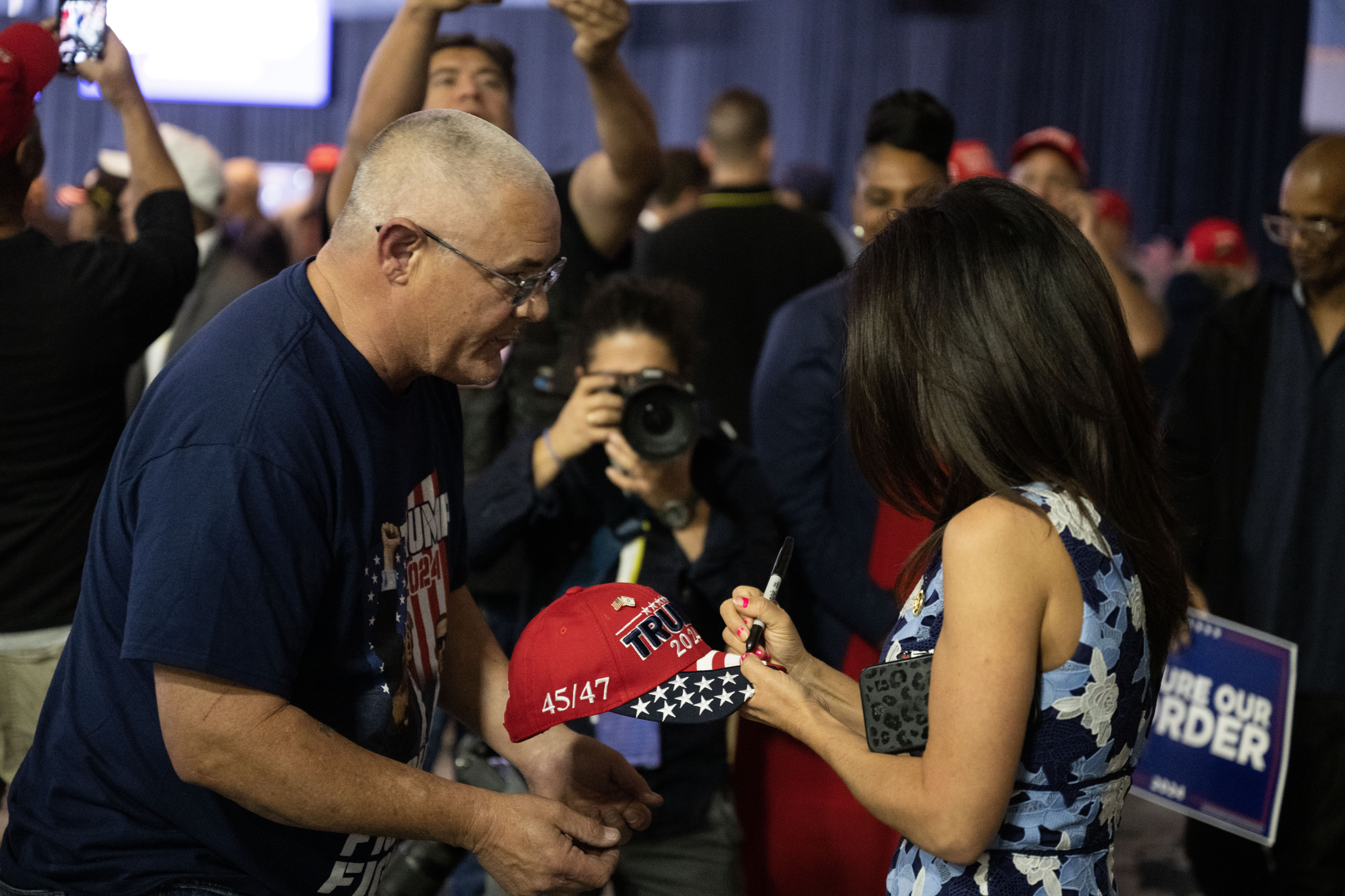 Bret Fox has his hat signed by Congresswoman Lauren Boebert before the start of a trump rally at the Gaylord Rockies Resort and Convention Center in Aurora on Friday, Oct. 11, 2024. (Stephen Swofford, Denver Gazette) (Stephen Swofford, Denver Gazette)