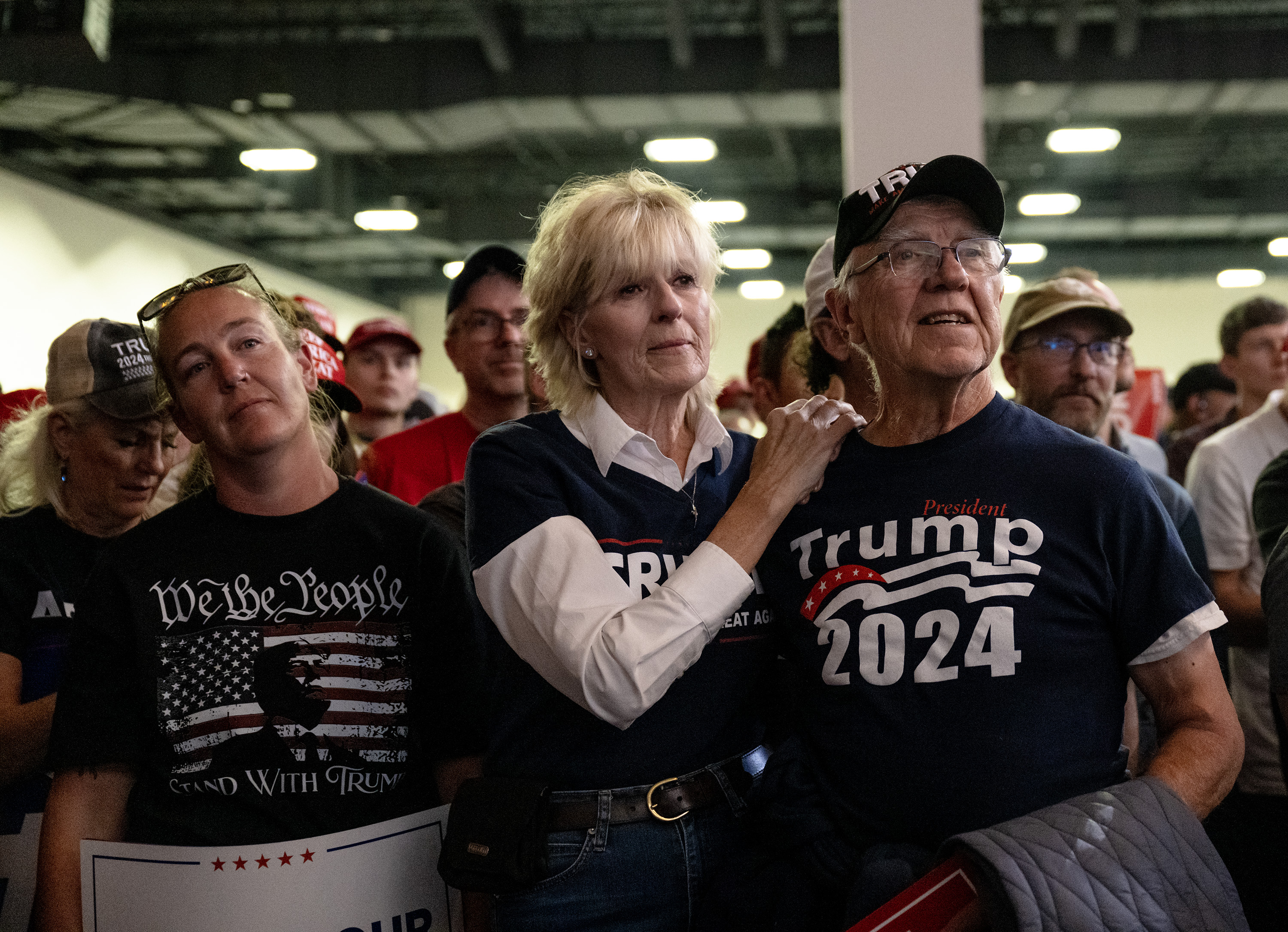 Kim Davis, center, and Joe Chalupa, of Littleton, watch as Republican presidential nominee former President Donald Trump makes remarks during a campaign rally at the Gaylord Rockies Resort and Convention Center, Friday, Oct. 11, 2024, in Aurora, Colo. (Parker Seibold, The Gazette) (Parker Seibold, The Gazette)