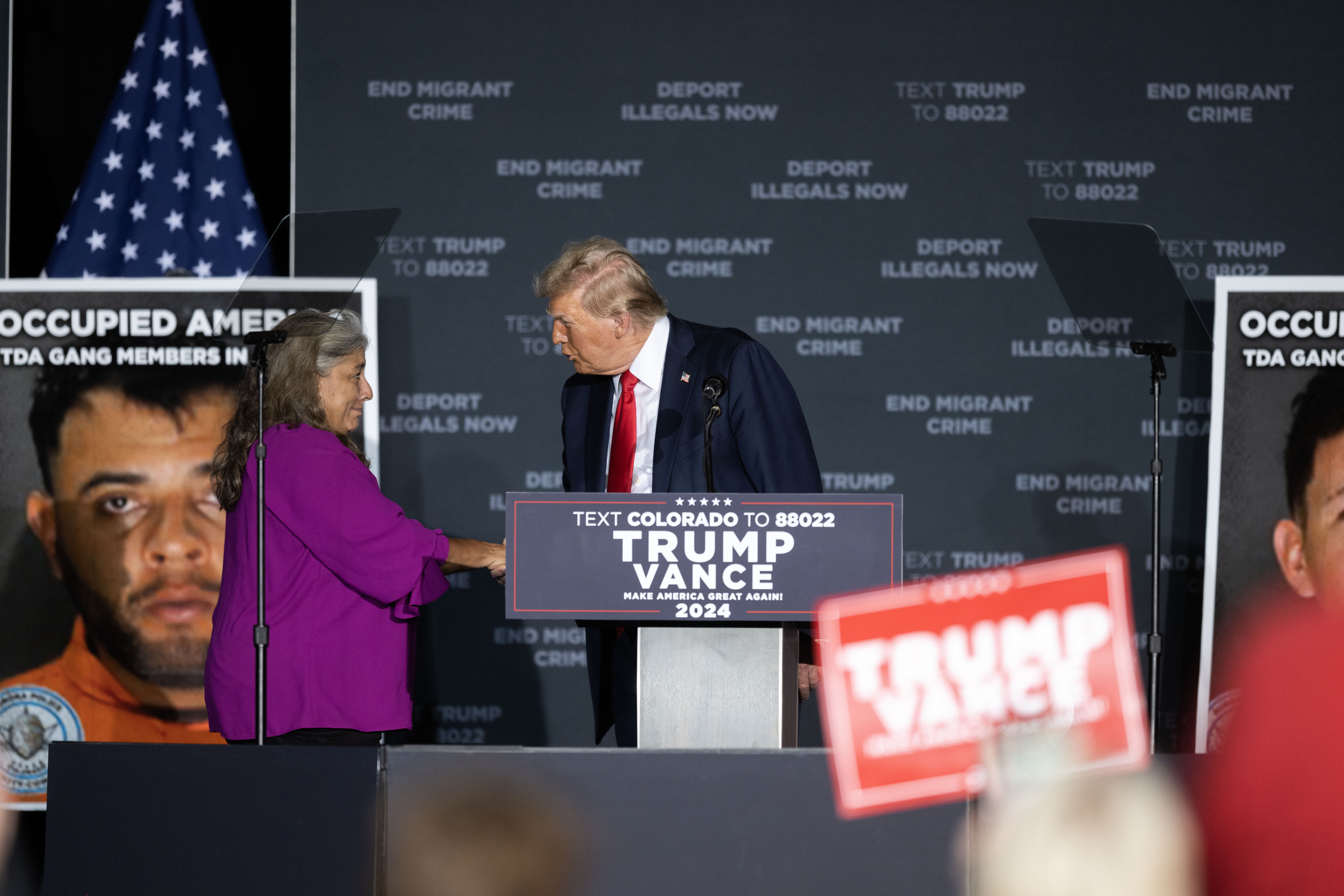 Cindy Romero shakes hands with Trump as he calls her onstage during a trump rally at the Gaylord Rockies Resort and Convention Center in Aurora on Friday, Oct. 11, 2024. (Stephen Swofford, Denver Gazette) (Stephen Swofford Denver Gazette)