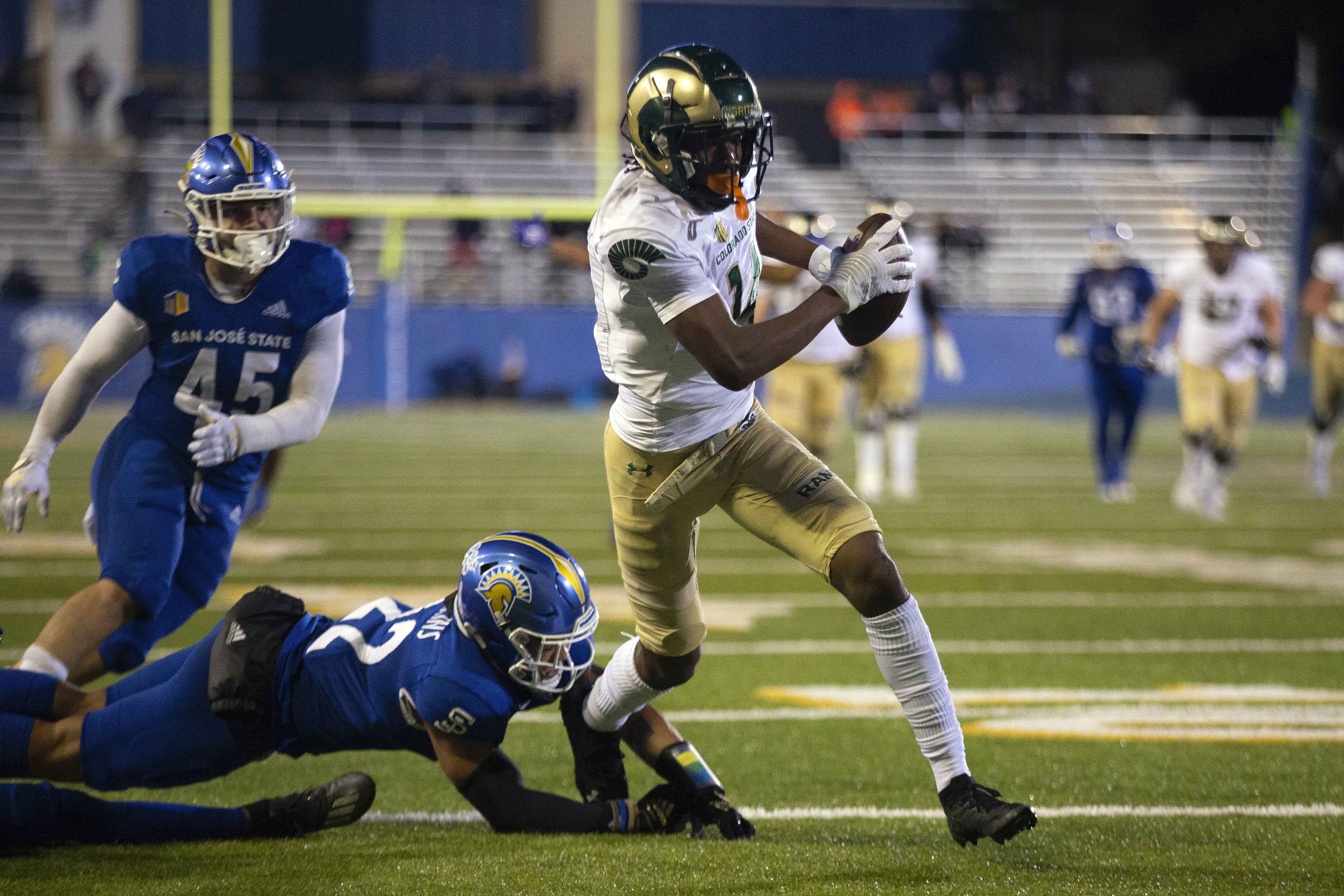 Colorado State wide receiver Tory Horton (14) eludes three San Jose State defenders on his way to a touchdown reception during the fourth quarter of an NCAA college football game, Saturday, Nov. 5, 2022, in San Jose, Calif. (AP Photo/D. Ross Cameron) (D. Ross Cameron)