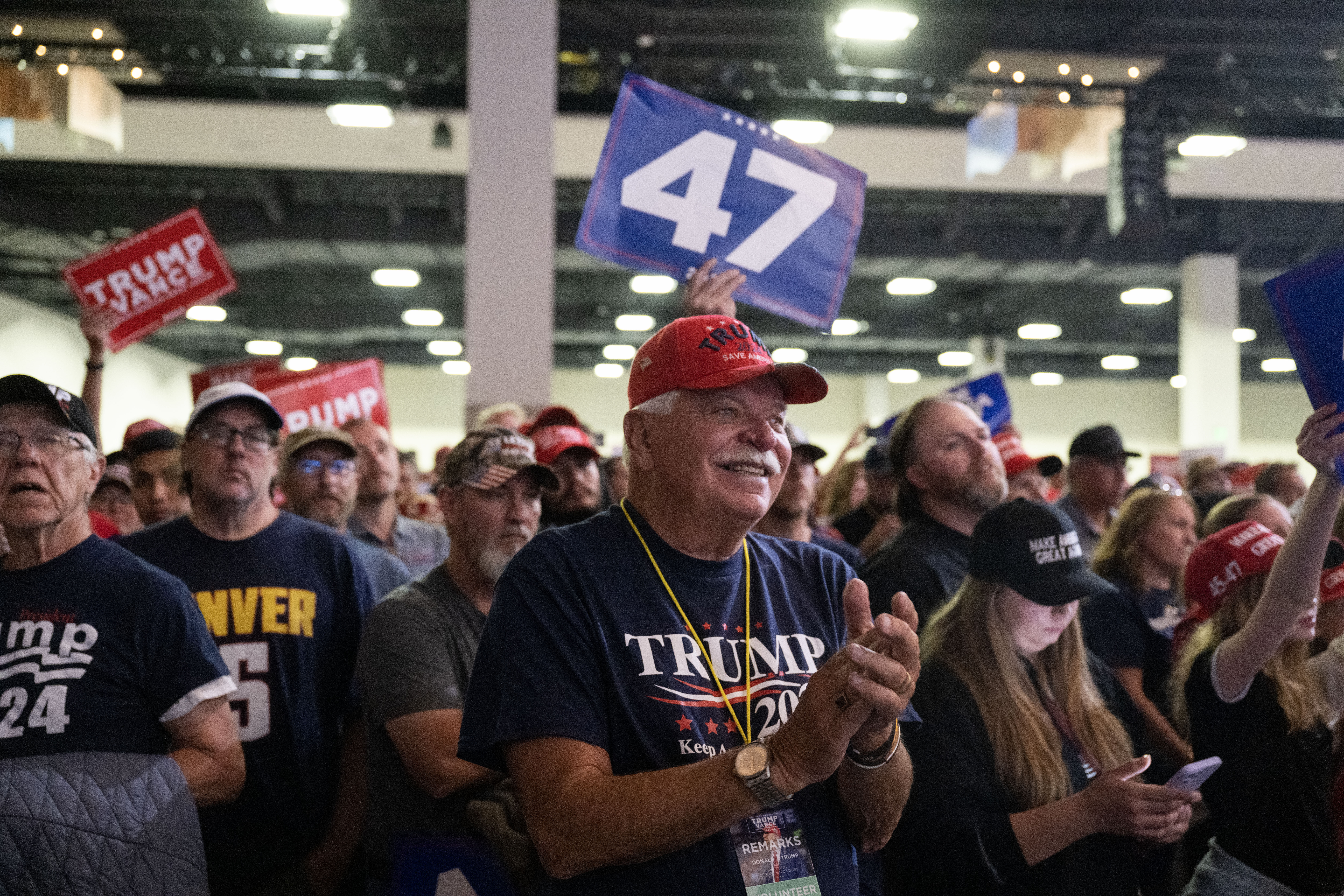 The crowd cheers and waves signs and phones during a Trump rally at the Gaylord Rockies Resort and Convention Center in Aurora on Friday, Oct. 11, 2024. (Stephen Swofford, Denver Gazette) (Stephen Swofford Denver Gazette)