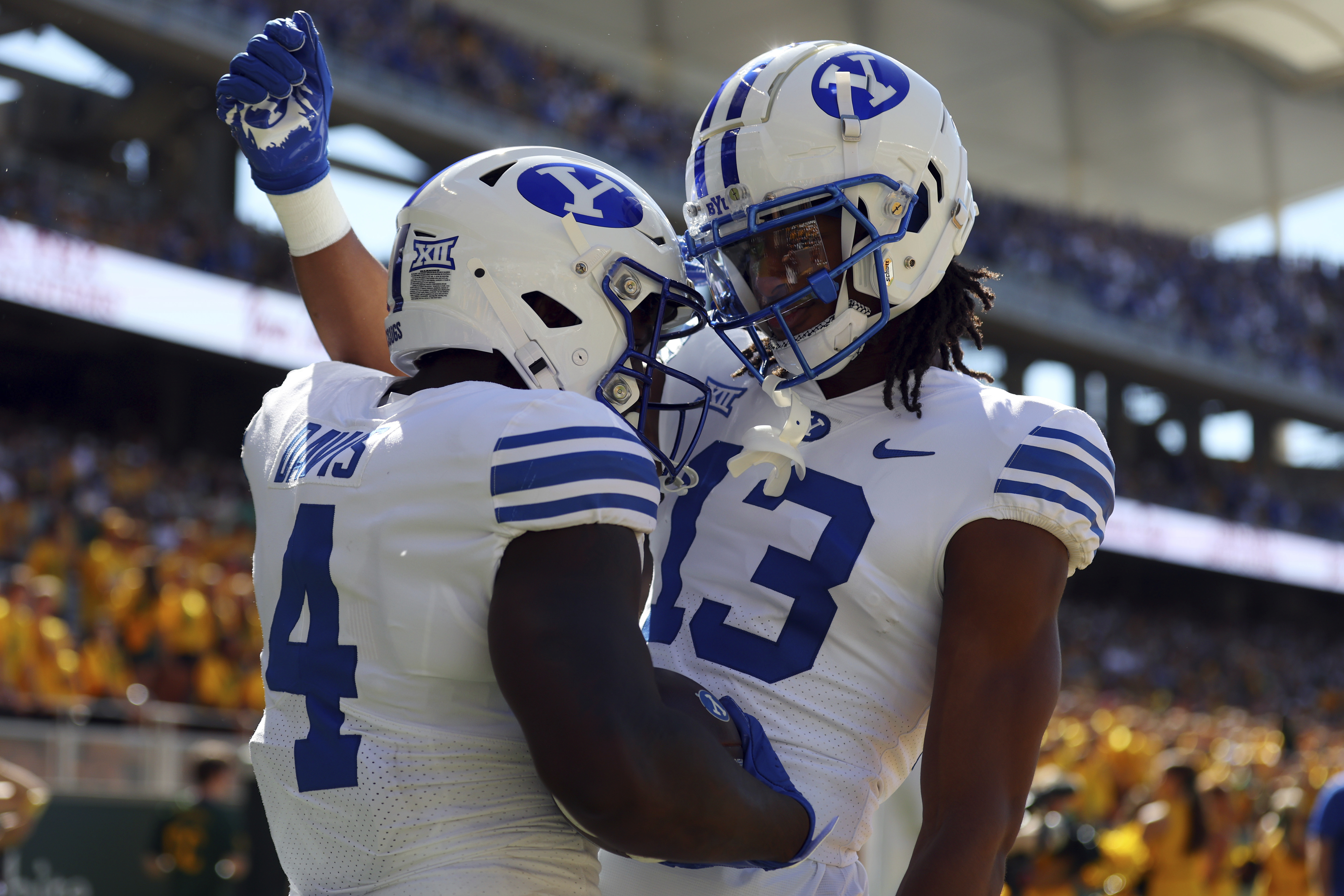 BYU running back Miles Davis (4) celebrates with teammate Jojo Phillips (13) after a touchdown in the first half against Baylor during an NCAA college football game on Saturday, Sept. 28, 2024, in Waco, Texas. (AP Photo/Richard W. Rodriguez) (Richard W. Rodriguez)