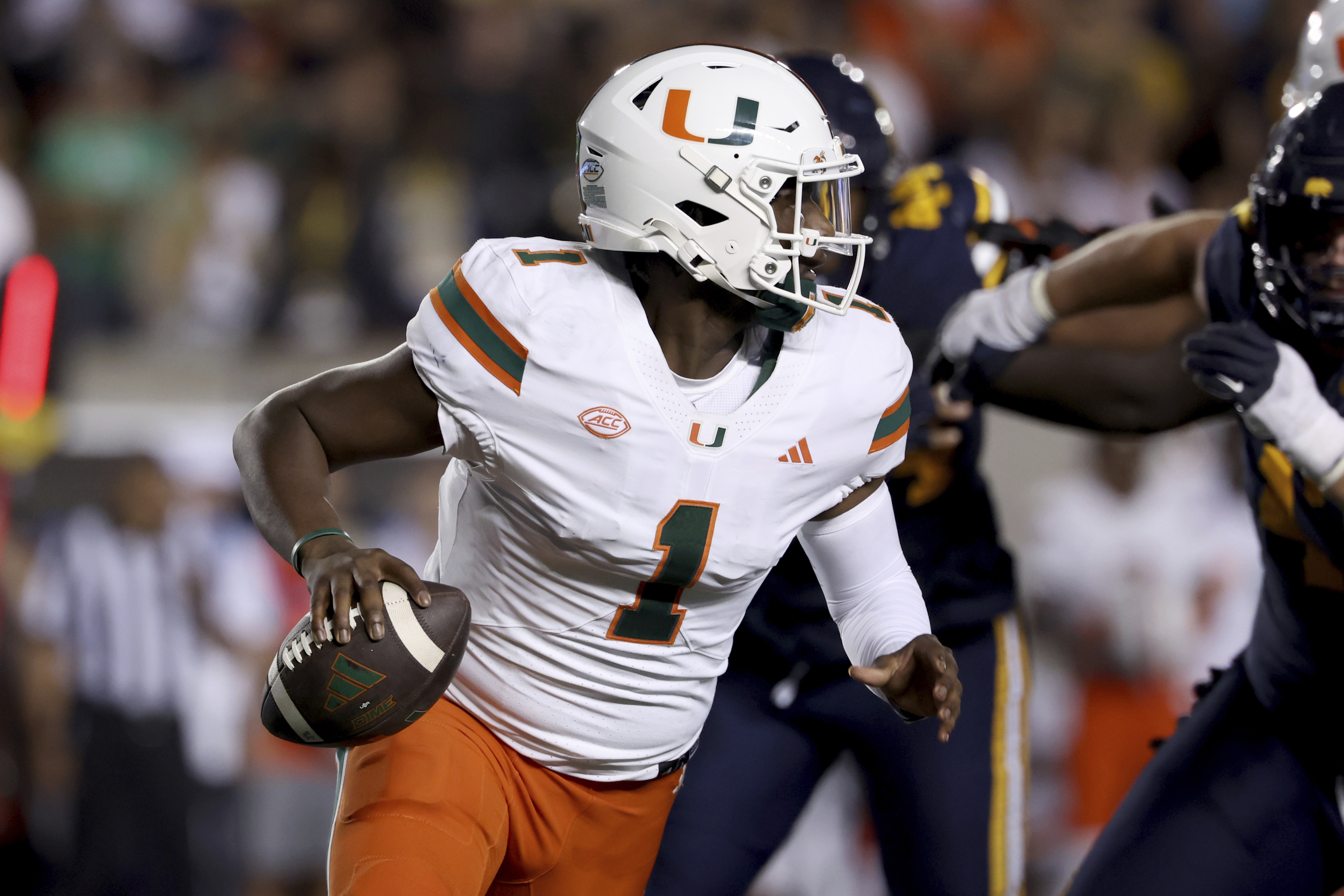Miami quarterback Cam Ward (1) runs against California during the first half of an NCAA college football game in Berkeley, Calif., Saturday, Oct. 5, 2024. (AP Photo/Jed Jacobsohn) (Jed Jacobsohn)