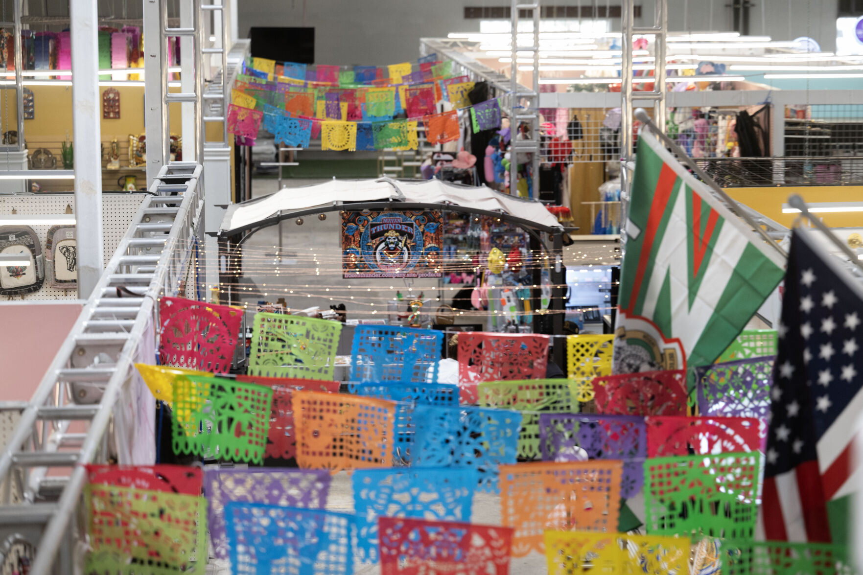 Flags hang between kiosks in the newly opened La Plaza on Friday, July 19, 2024. (Stephen Swofford, Denver Gazette) (StephenSwoffordPhotographerstephen.swofford@gazette.comhttps://secure.gravatar.com/avatar/1ddcaf11c5d70eaa58546ddc4e038687?d=mm&r=g)