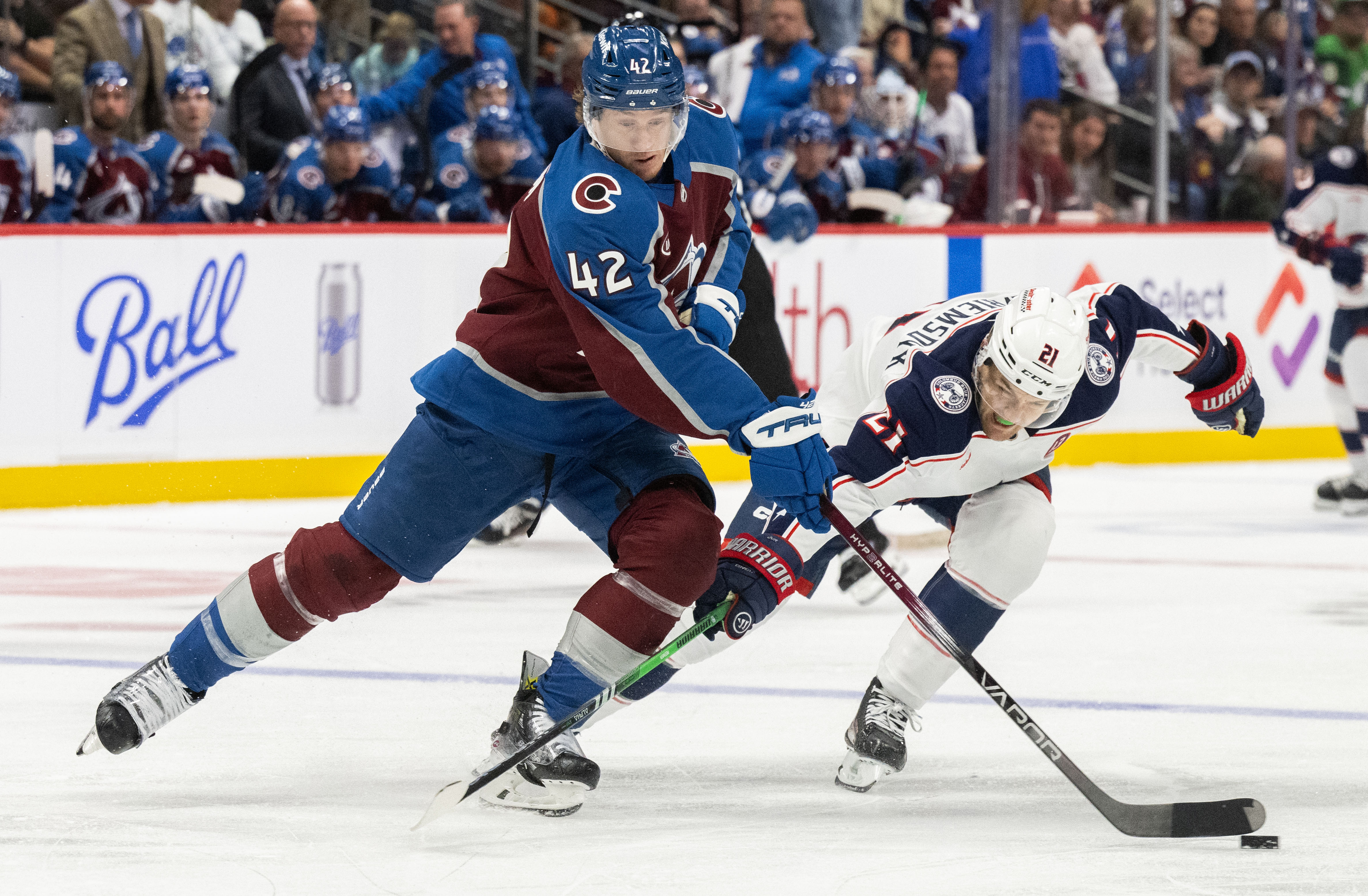 Colorado Avalanche defenseman Josh Manson (42) battles Columbus Blue Jackets left wing James van Riemsdyk (21) for the puck during the second period Saturday, Oct. 12, 2024, at Ball Arena in Denver. (The Gazette, Christian Murdock) (Christian Murdock)