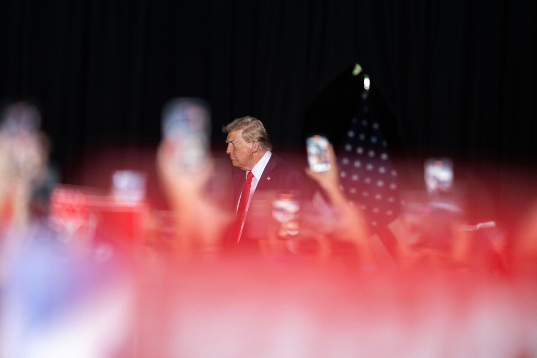 The crowd cheers and waves signs and phones as Trump takes the stage during a political rally at the Gaylord Rockies Resort and Convention Center in Aurora on Oct. 11. (The Denver Gazette)