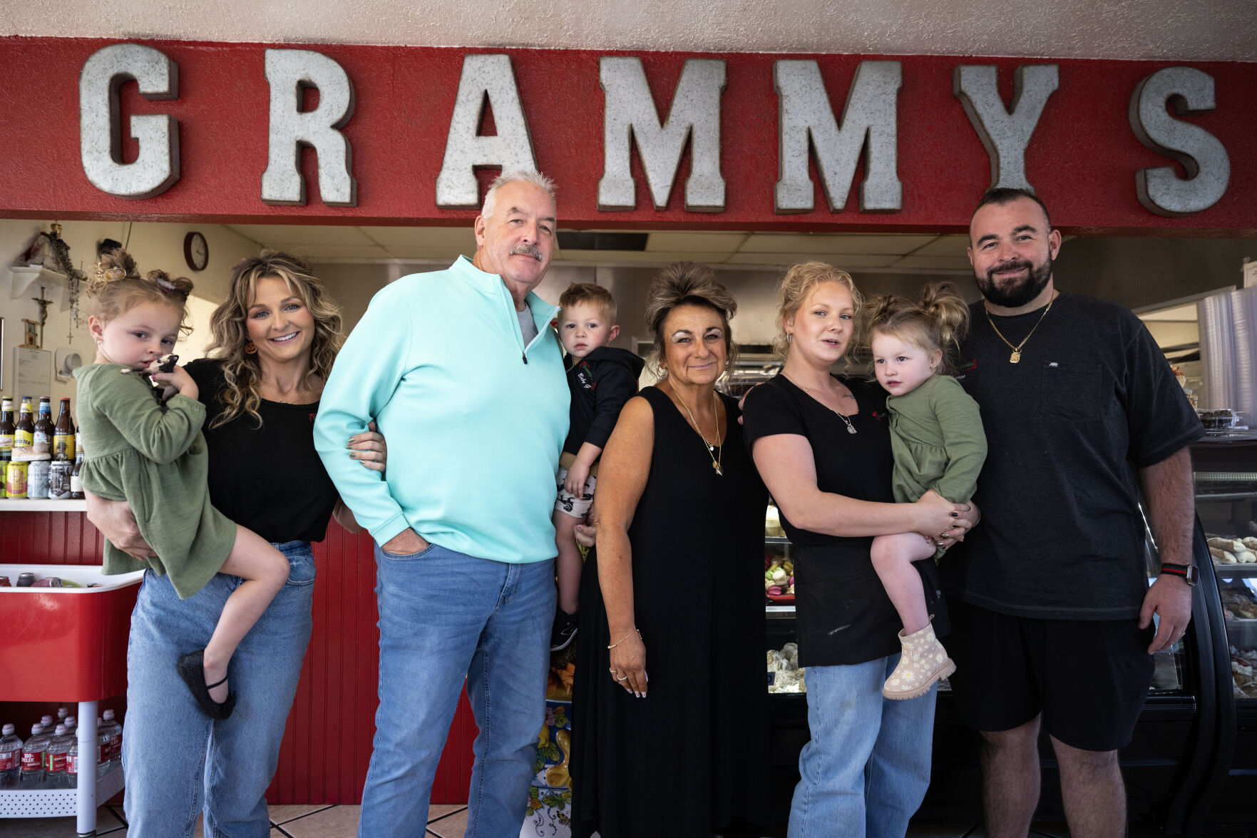 The Corder family, from left, Ellie Jo, 4, Joeylyn, Jeff, baby George, 2, Vickie, Kylie, Stella Lu, 3, and George pose for a photo inside Grammy’s Goodies in Wheat Ridge this month. (StephenSwoffordPhotographerstephen.swofford@gazette.comhttps://secure.gravatar.com/avatar/1ddcaf11c5d70eaa58546ddc4e038687?d=mm&r=g)