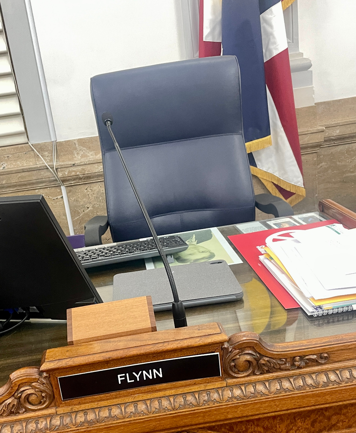 Kevin Flynn's desk in the Denver City Council chambers. The photo under the glass is of one of Flynn's late brothers. (JOHN MOORE/DENVER GAZETTE)