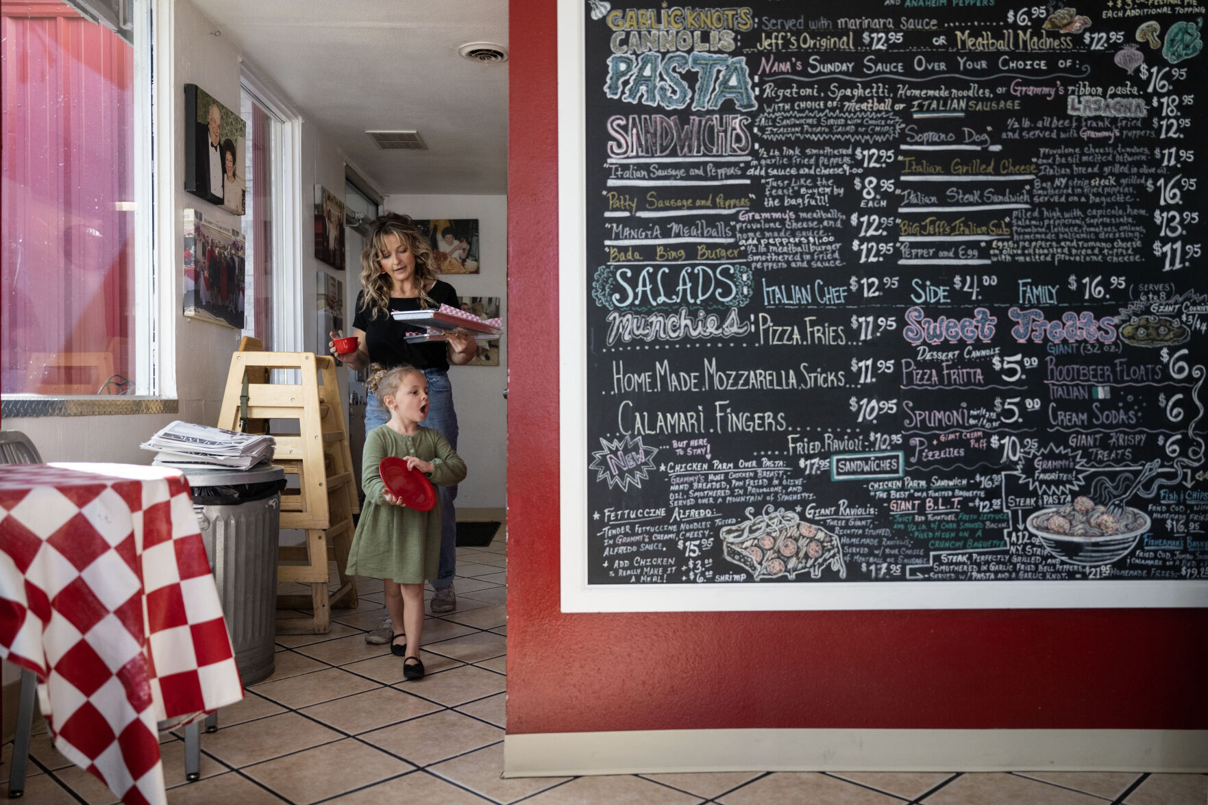 Ellie Jo Corder, 4, helps her aunt, Joeylyn Corder, carry food and plates to a customer’s table as they work at Grammy’s Goodies in Wheat Ridge on Thursday, Oct. 3 this month. (StephenSwoffordPhotographerstephen.swofford@gazette.comhttps://secure.gravatar.com/avatar/1ddcaf11c5d70eaa58546ddc4e038687?d=mm&r=g)