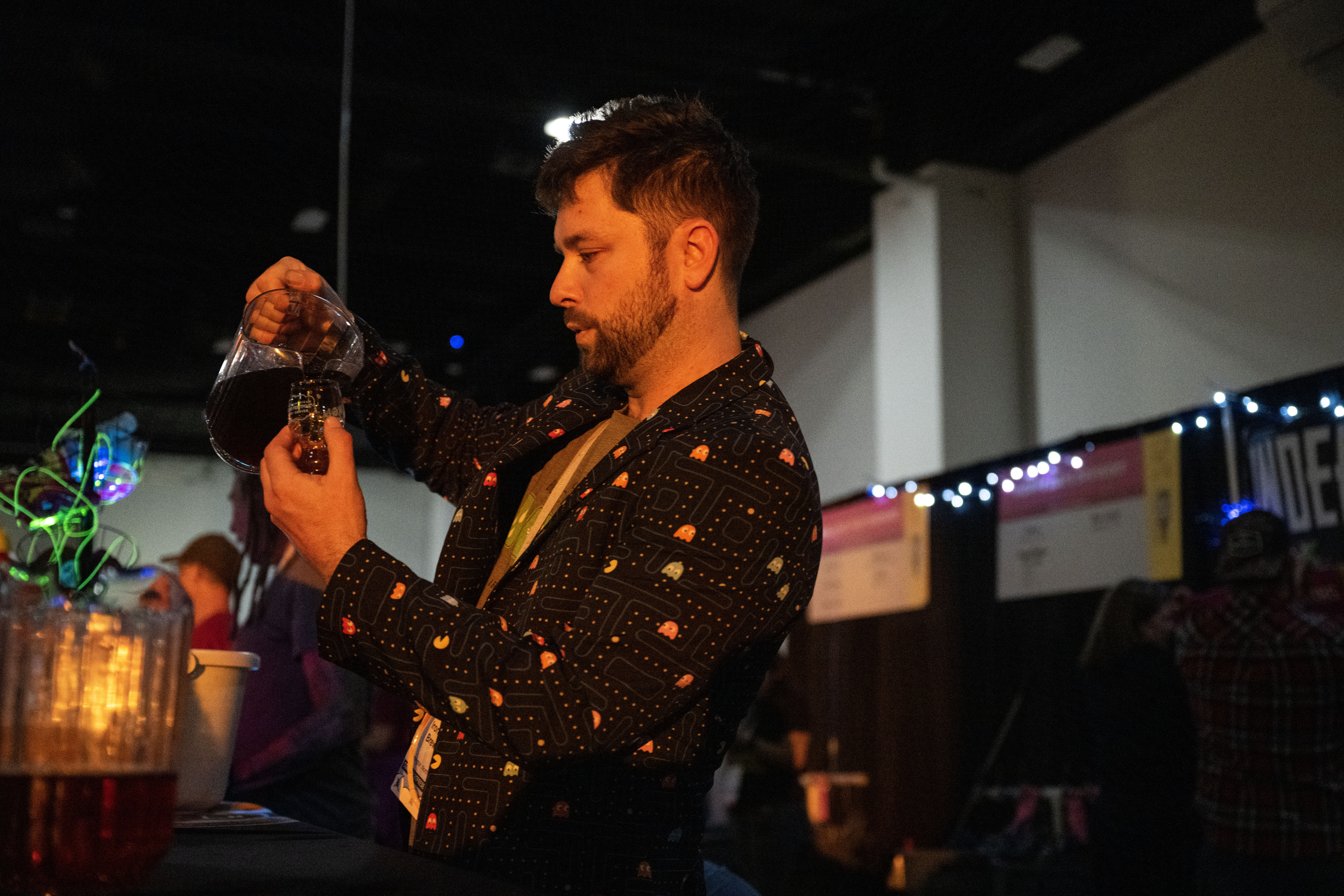 Laren “The Wizard” Avery pours a sample from Ironclad Brewery on the opening night of the Great American Beer Festival on Thursday, Oct. 10, 2024 (Stephen Swofford, Denver Gazette) (Stephen Swofford Denver Gazette)