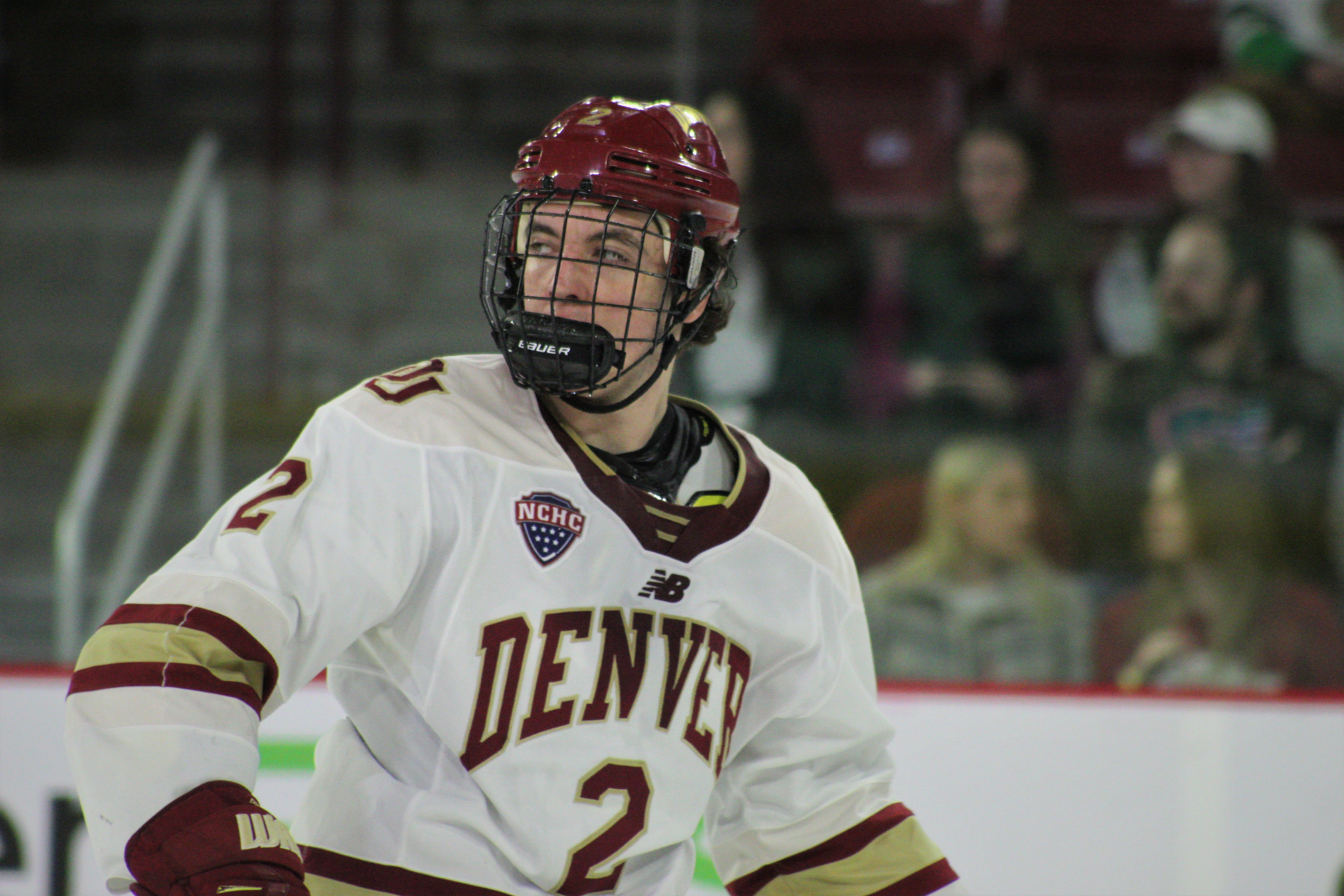 Denver sophomore defenseman Sean Behrens (2) watches the puck during the second period of a game against North Dakota on Saturday at Magness Arena in Denver. (Tyler King, The Denver Gazette)
