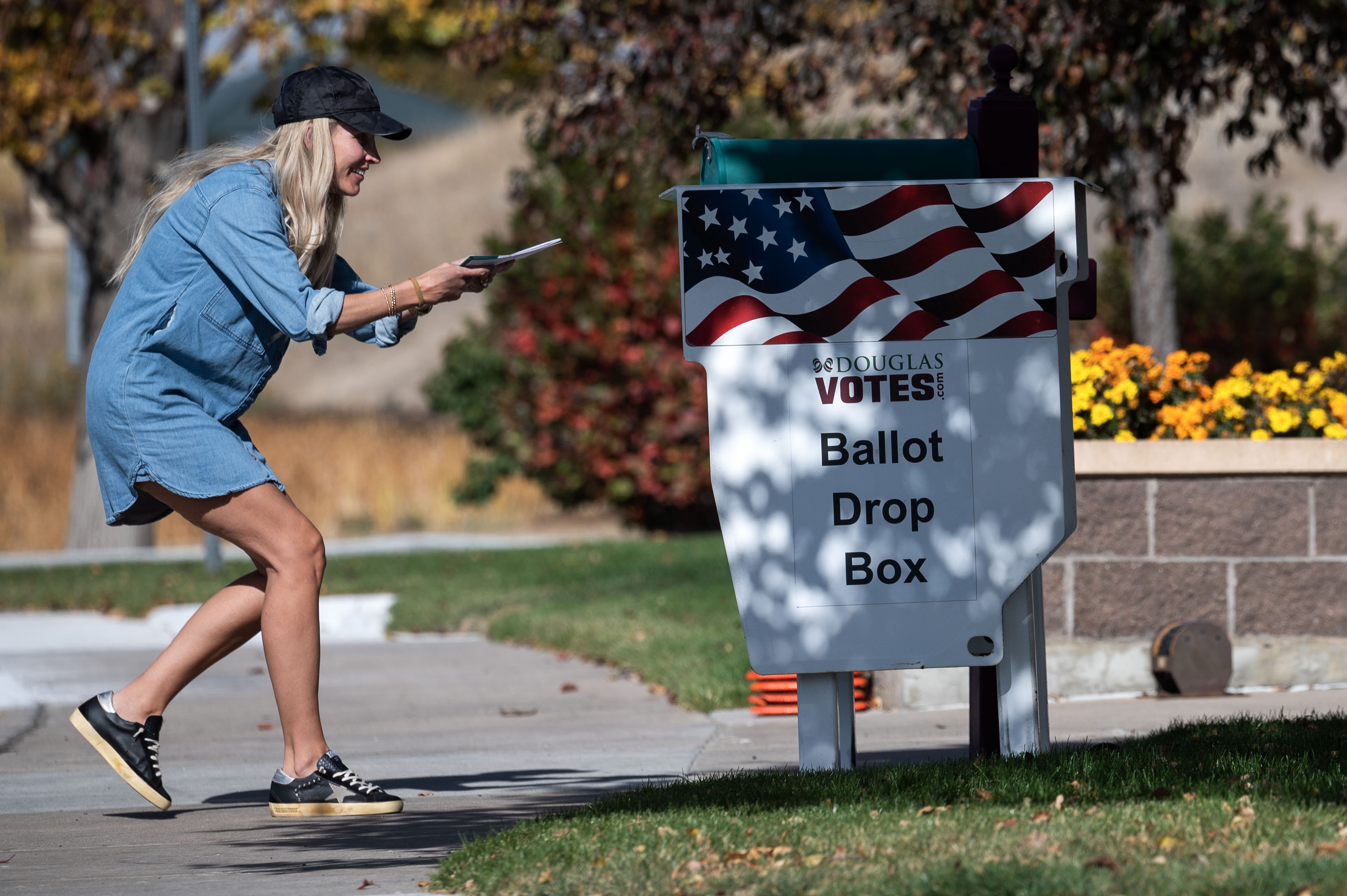People drop their ballots into a drop box in Highlands Ranch on Tuesday, Oct. 29, 2024 (Stephen Swofford, Denver Gazette) (Stephen Swofford Denver Gazette)